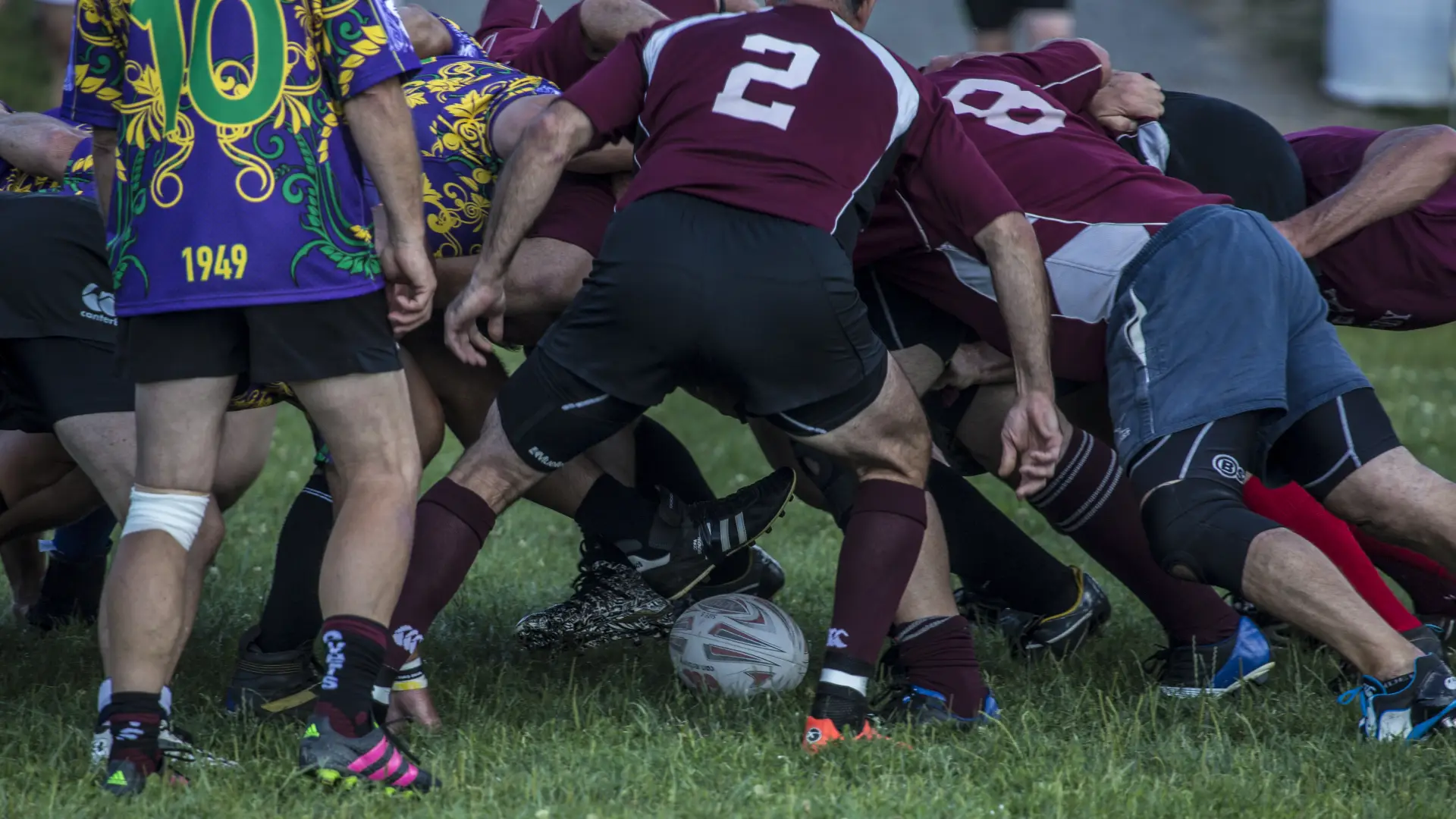 Rugy players pile up in a scrum