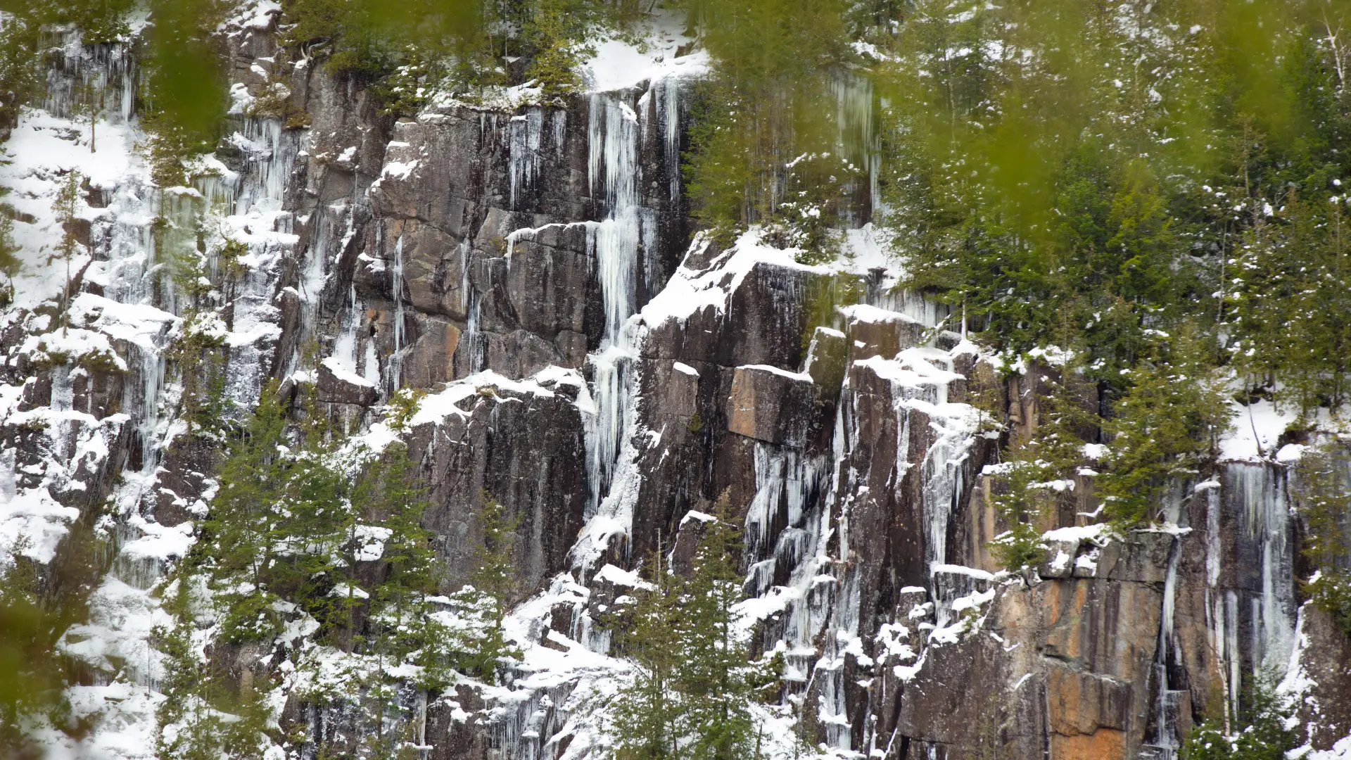 The rock wall makes fine iciciles.
