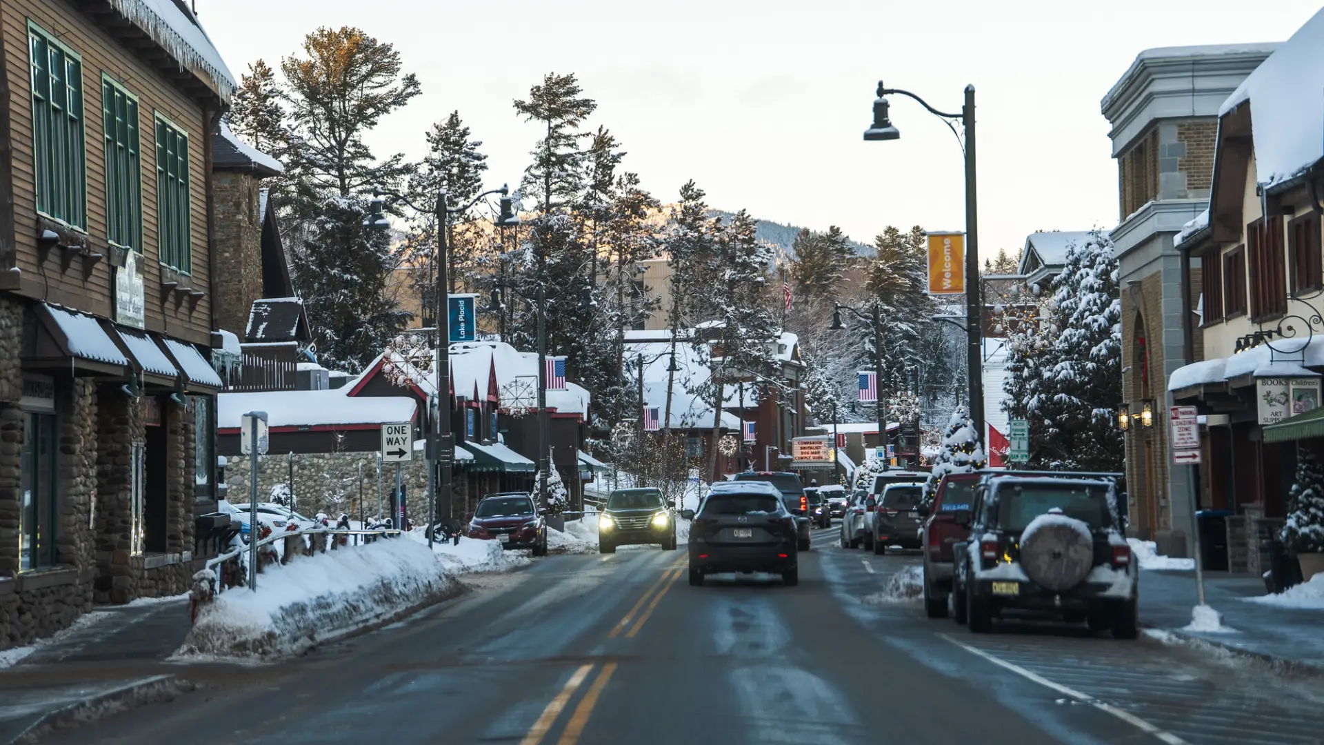 Lake Placid Main Street with cars during a snow storm.