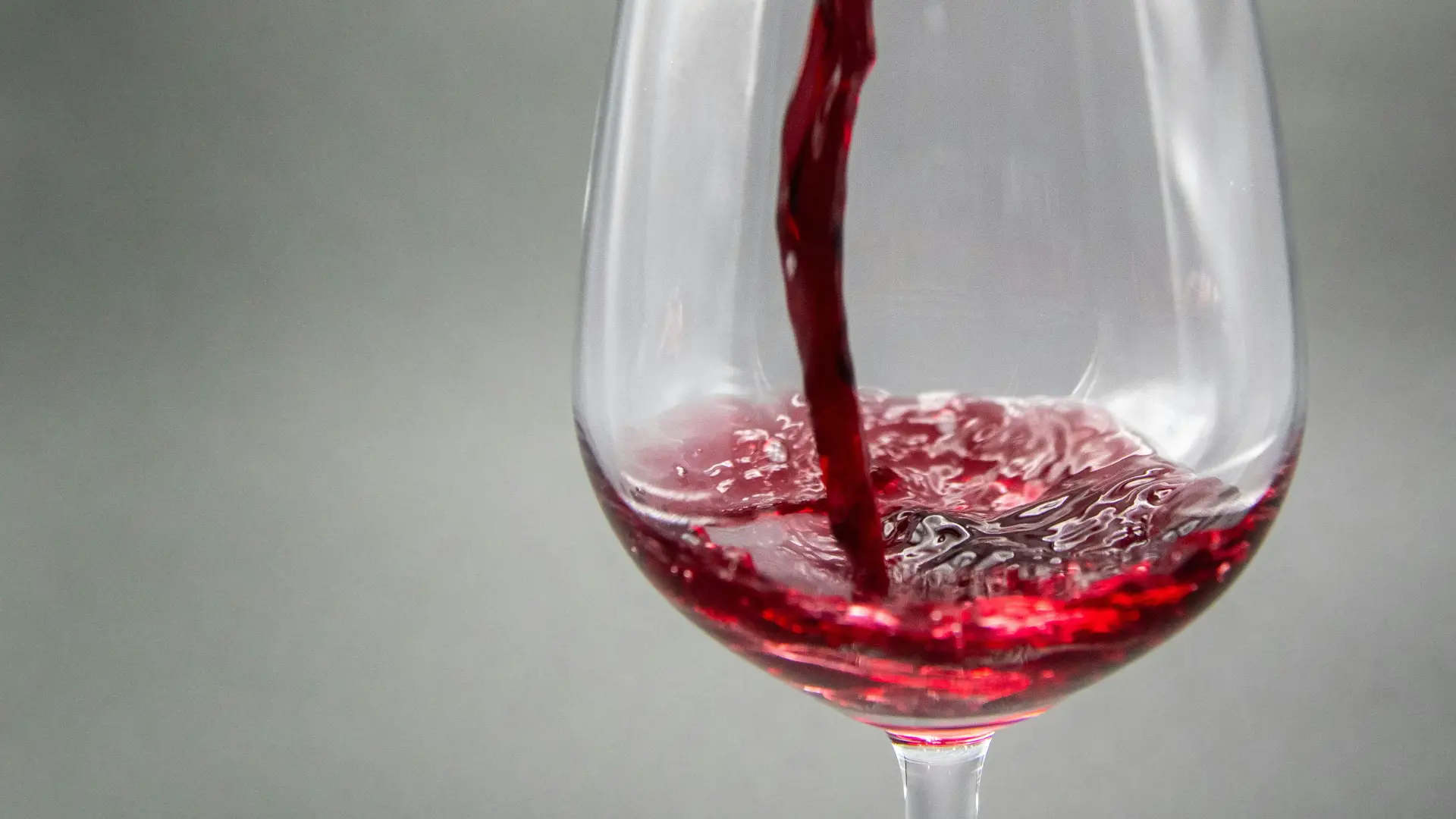 Red wine being poured into a glass