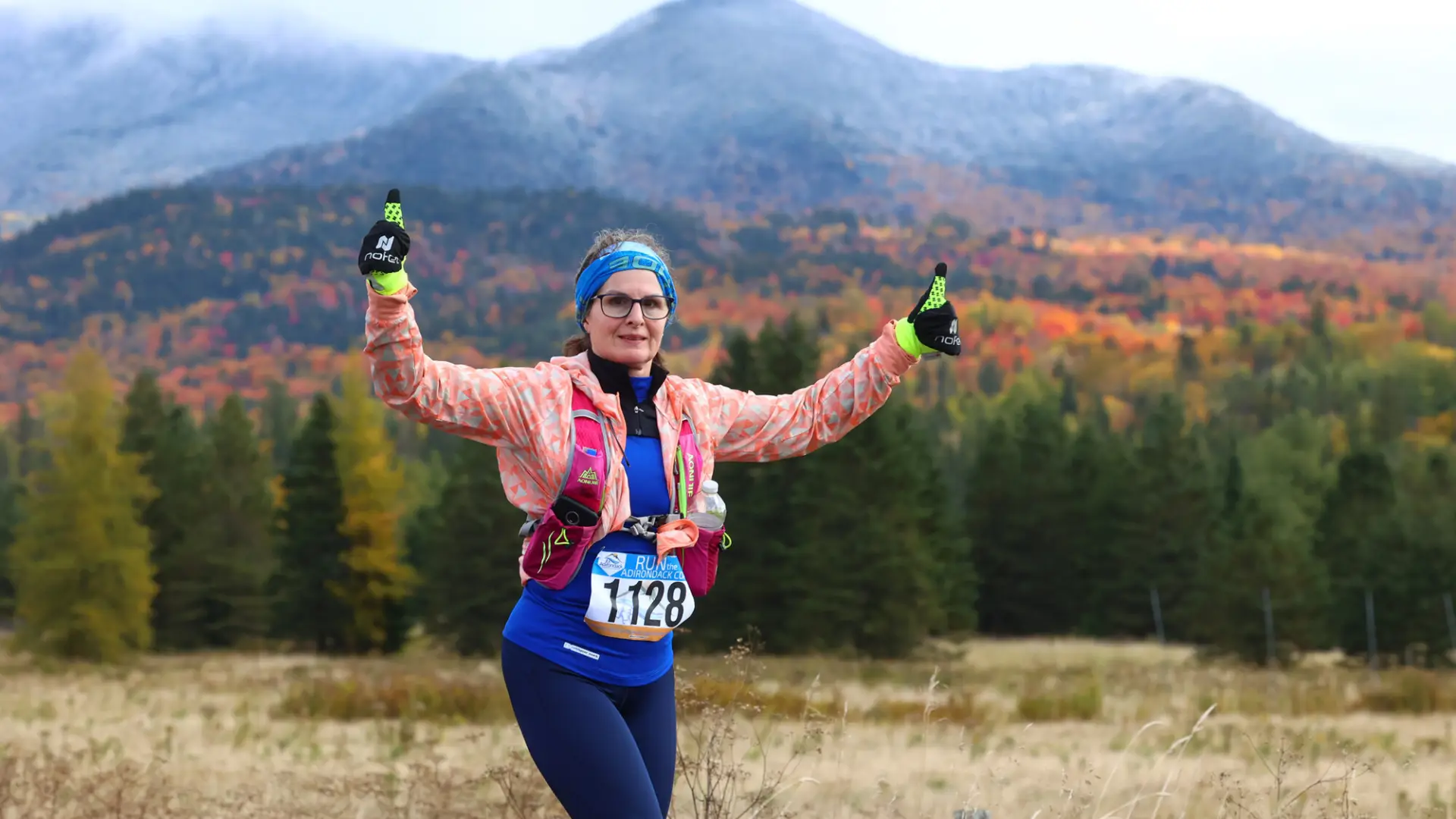 A woman running a half marathon during the fall.