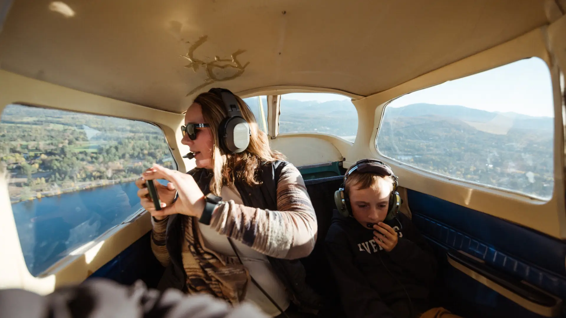 A family in the cockpit of a small plane