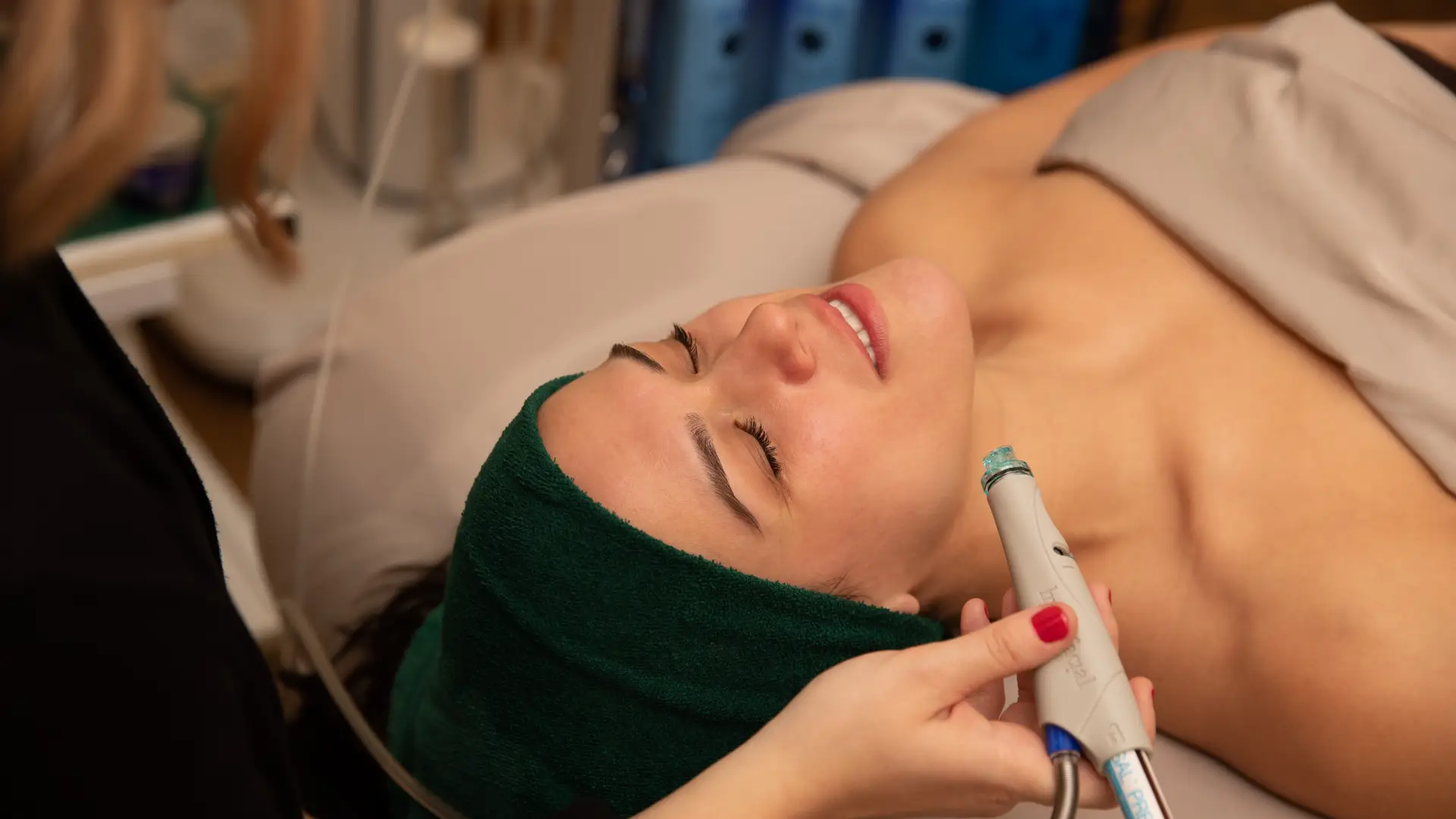 A woman enjoys a relaxing spa treatment.