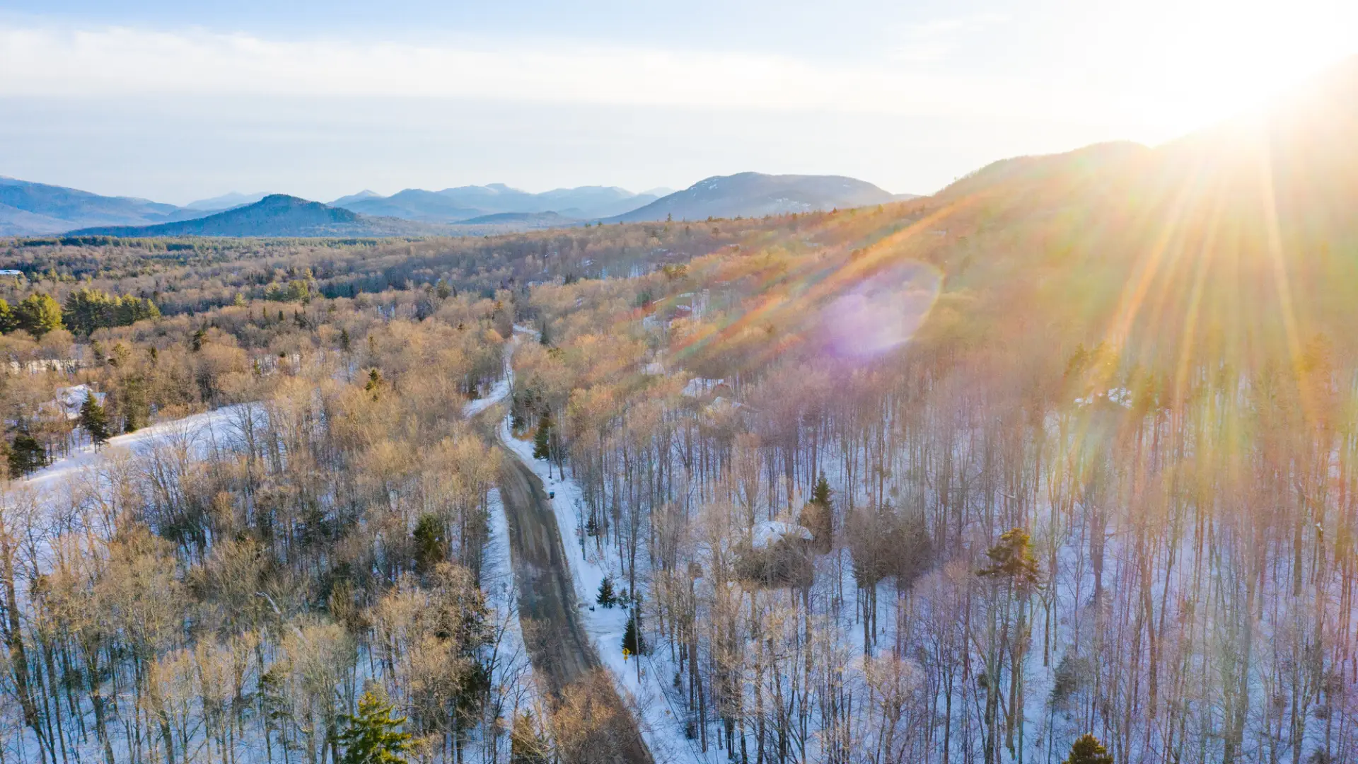 A scenic winter drive on a road in Lake Placid.