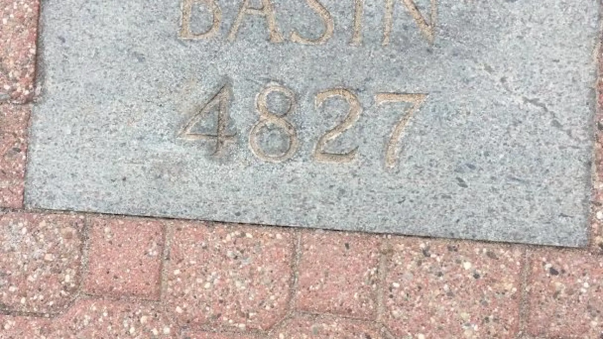 46er plaque for Basin Mountain, the ninth tallest mountain in the state.