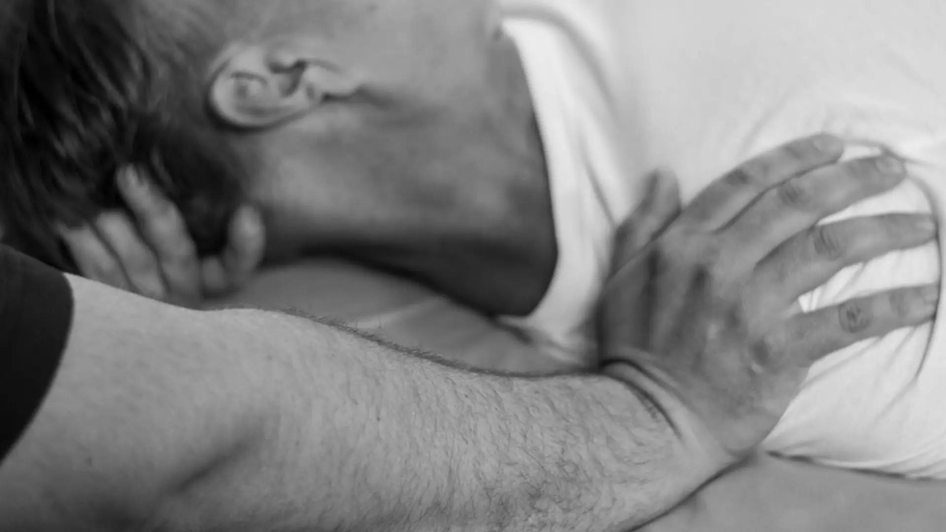 A massage therapist applies pressure to a shoulder to properly stretch the trap muscle during a massage at Healing Elements.