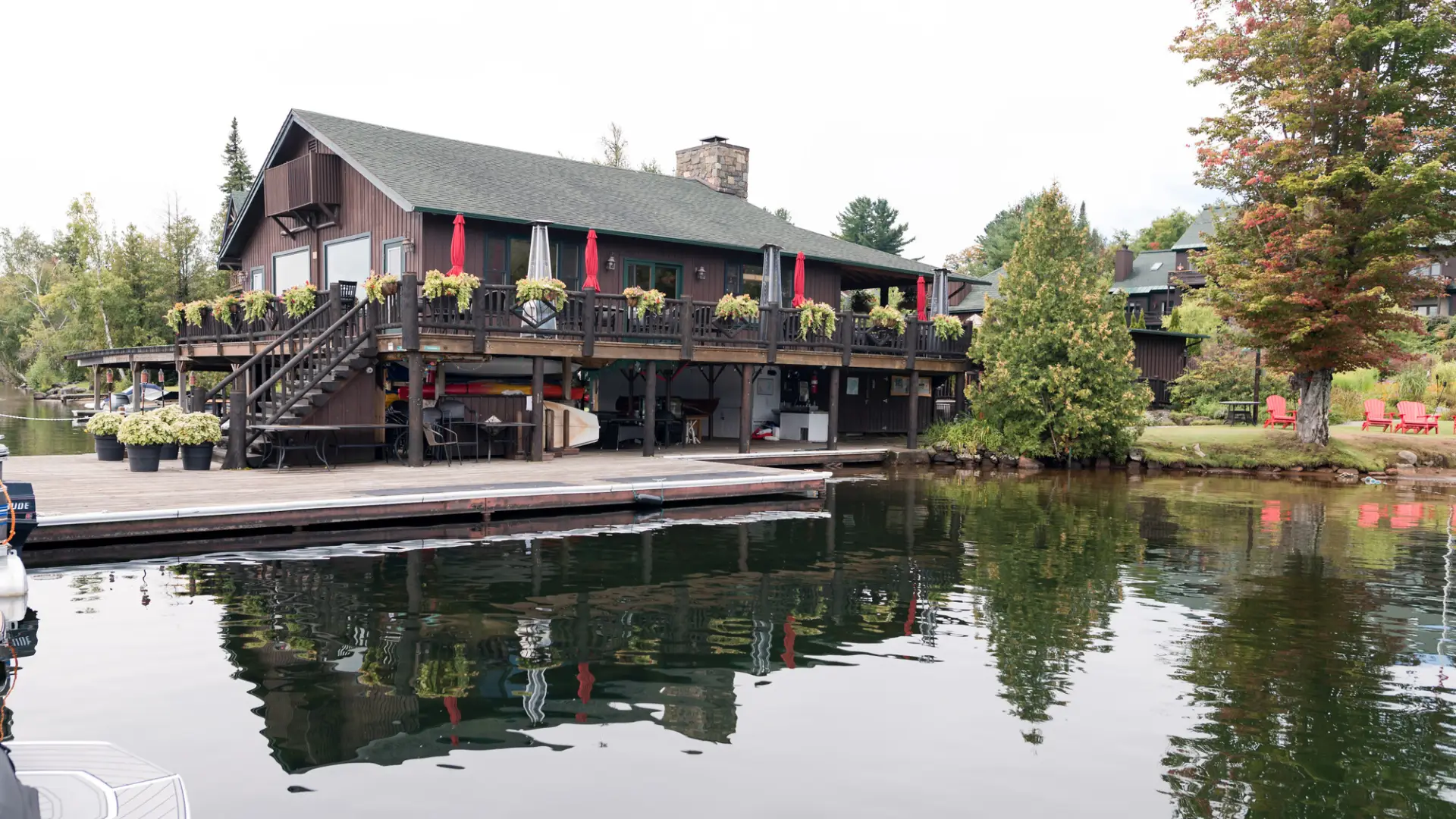 Moose Lodge Boathouse on the water of Lake Placid with flowerboxes