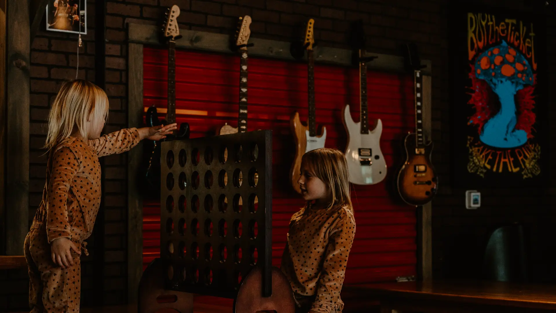Adding a puck to the giant connect four game.  Photo Credit to A. Kelly.
