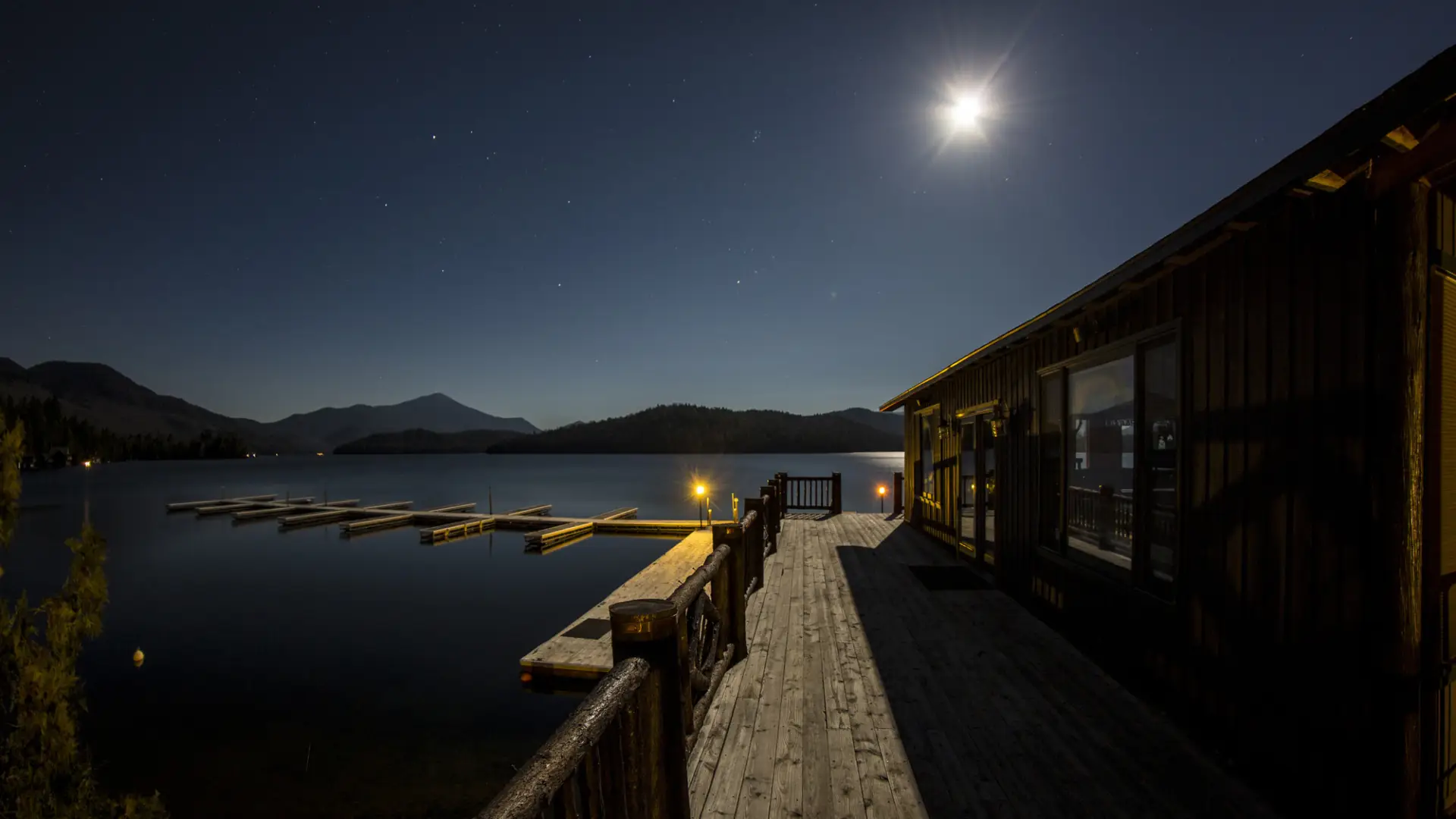 Whiteface Club dock on the water during a full moon.