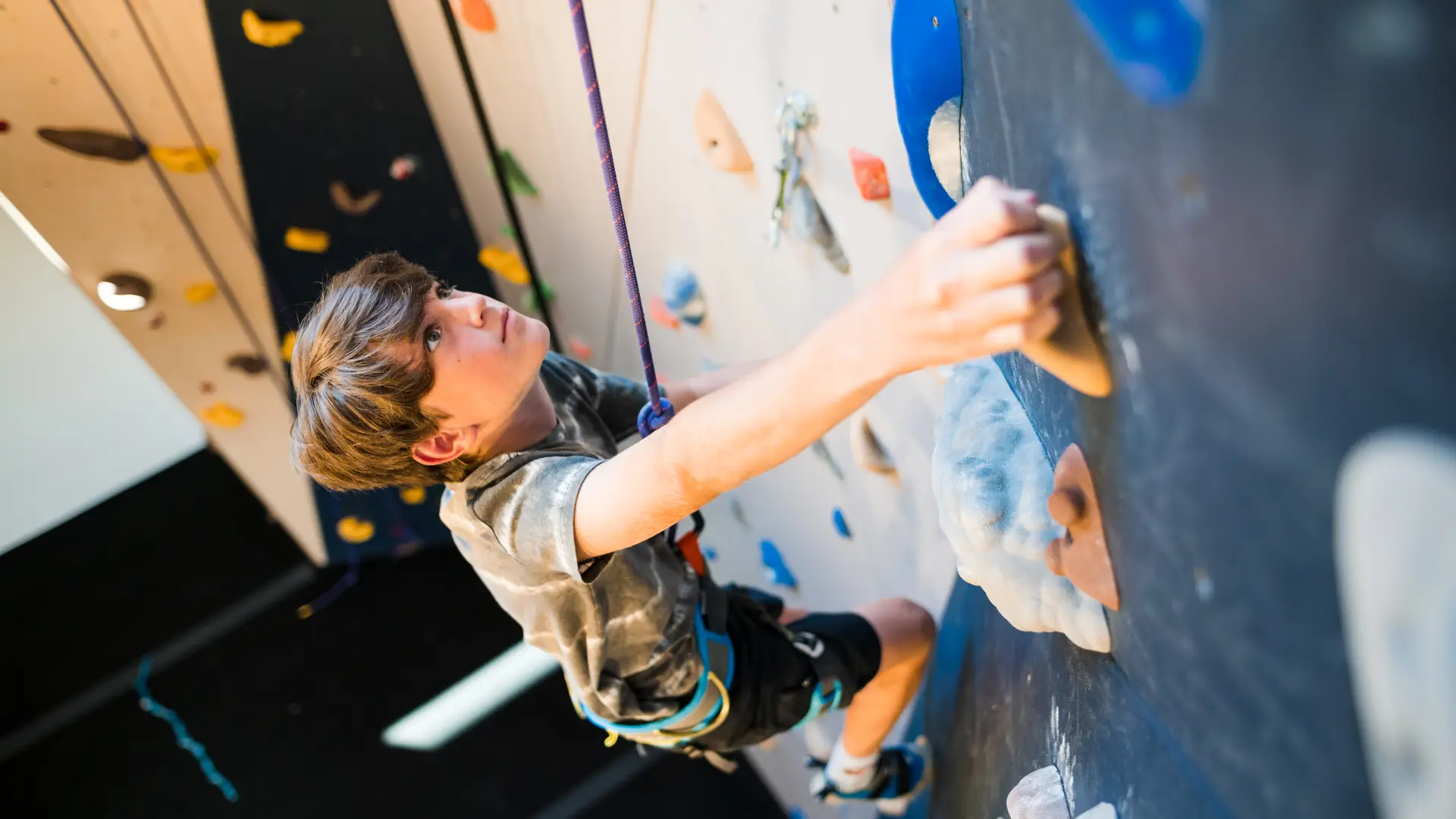 Child climbs wall at Rock Climbing Center