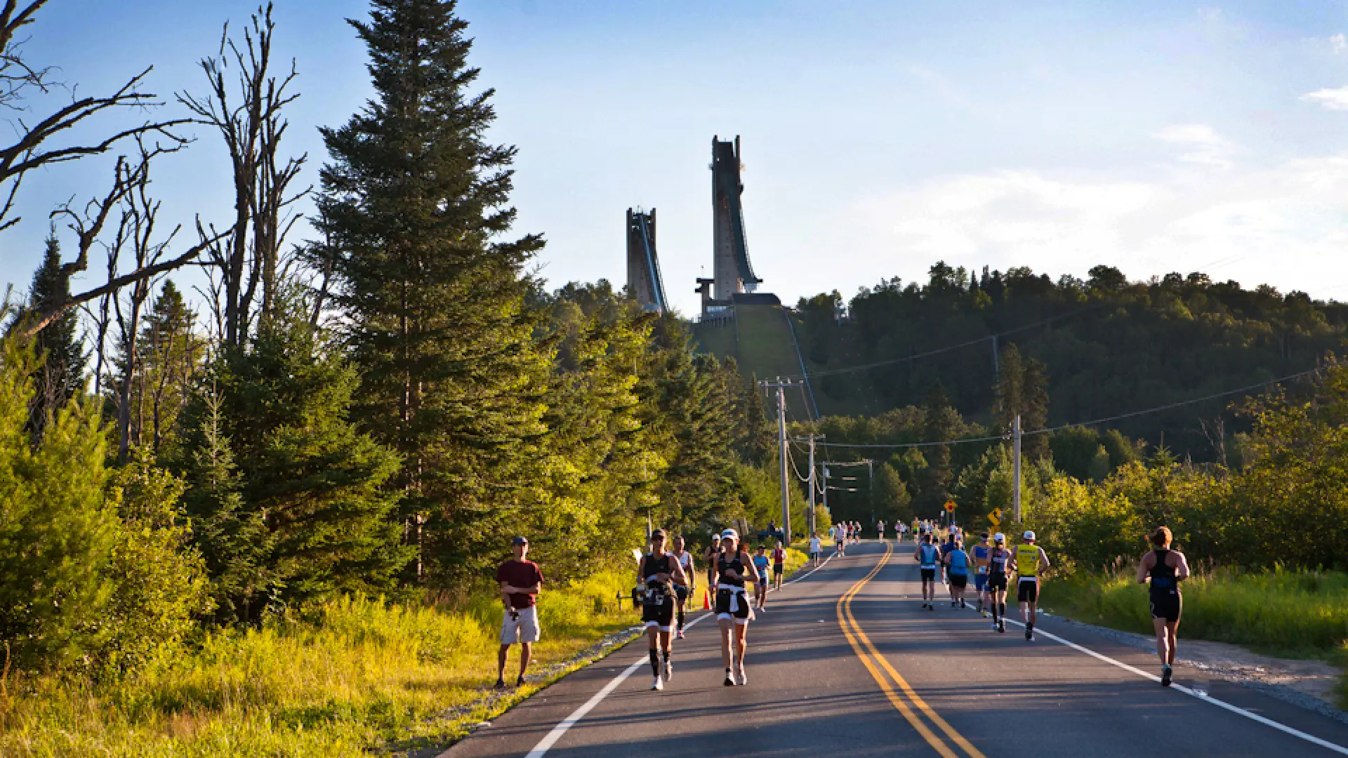 Runners heading out River Road in the 2013 Lake Placid Classic Half Marathon