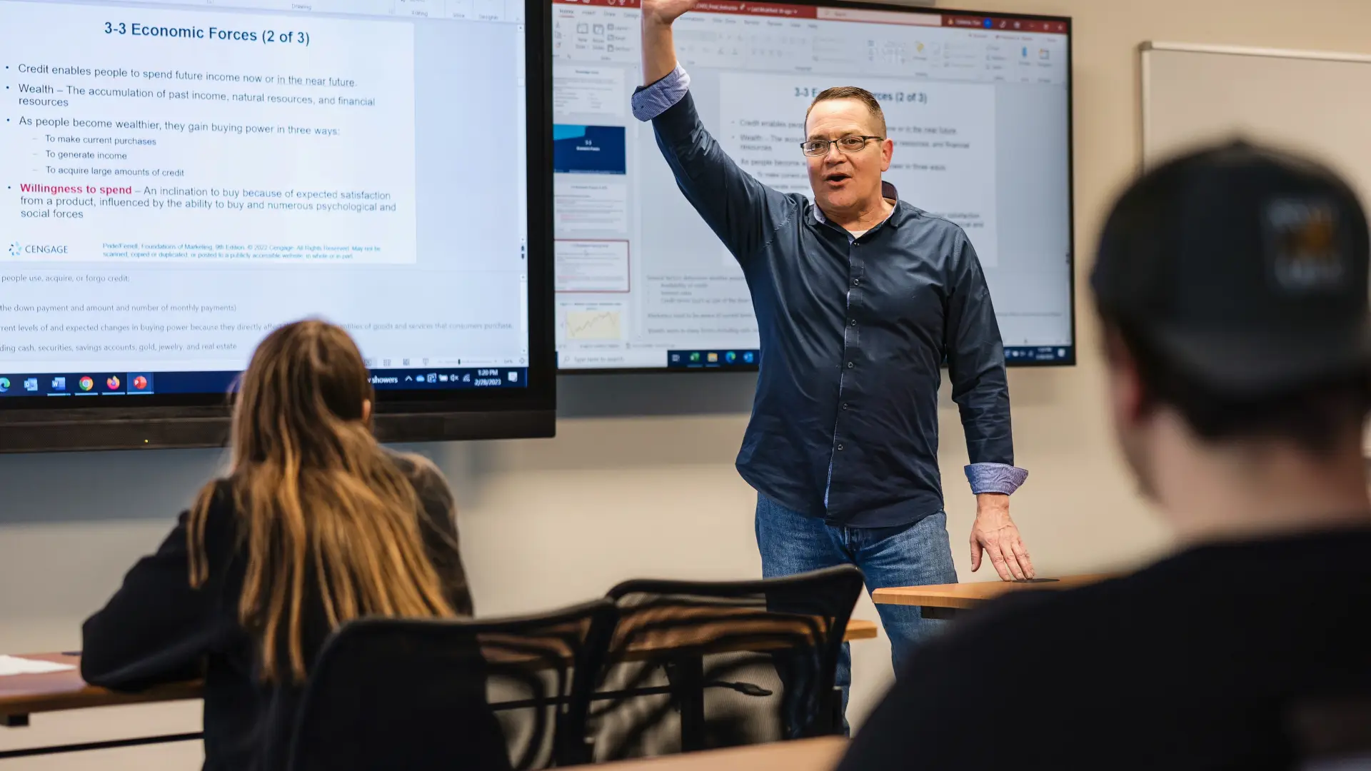 A man teaches class in a classroom.