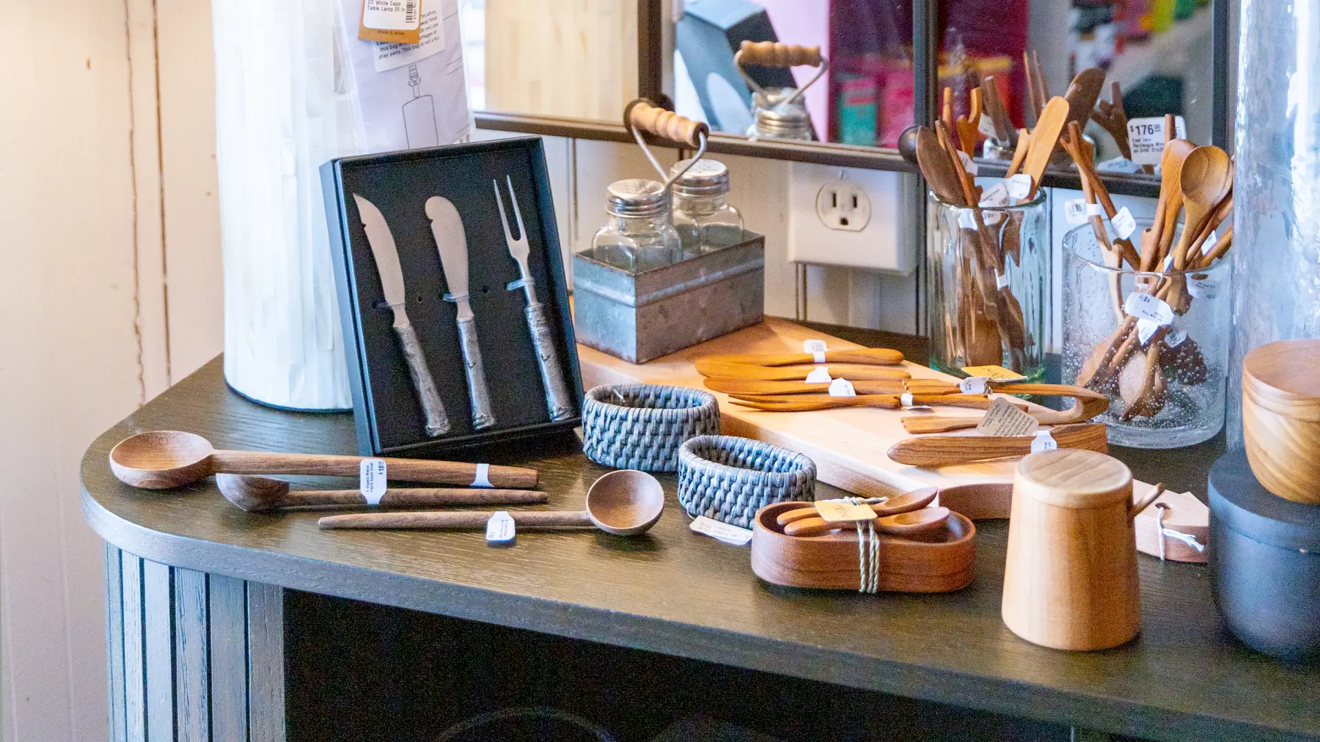 Various cutlery and serving wares on display