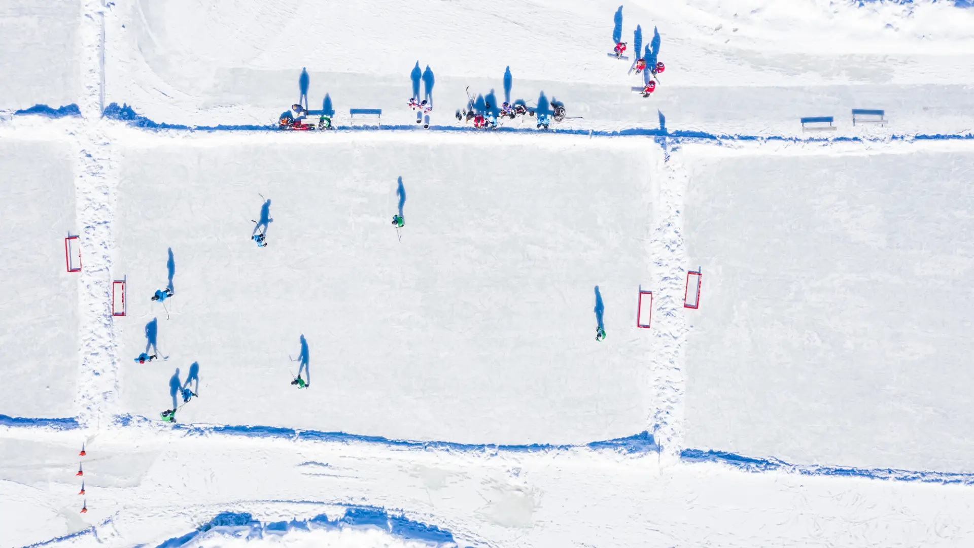 Aerial of people skating on Mirror Lake, Lake Placid, NY.