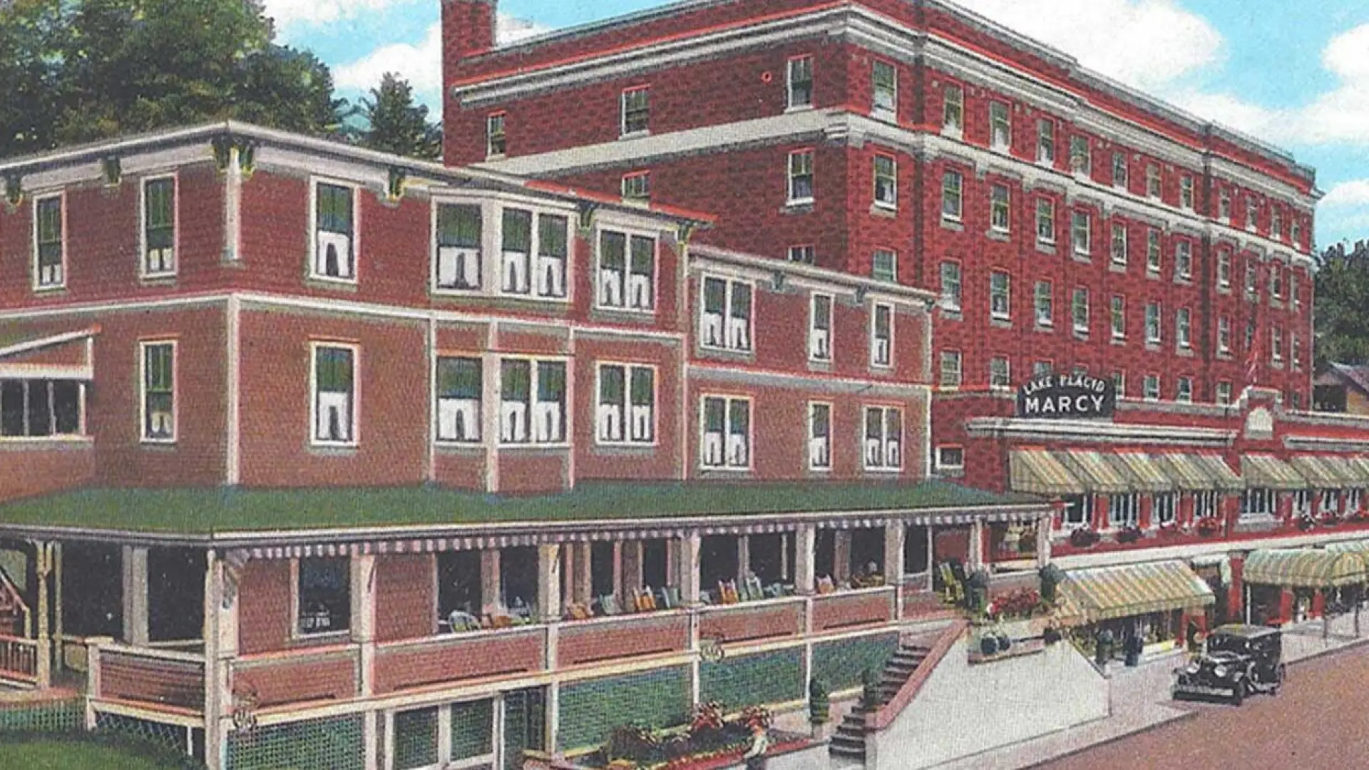 A vintage postcard illustration of the Hotel Marcy in Lake Placid.
