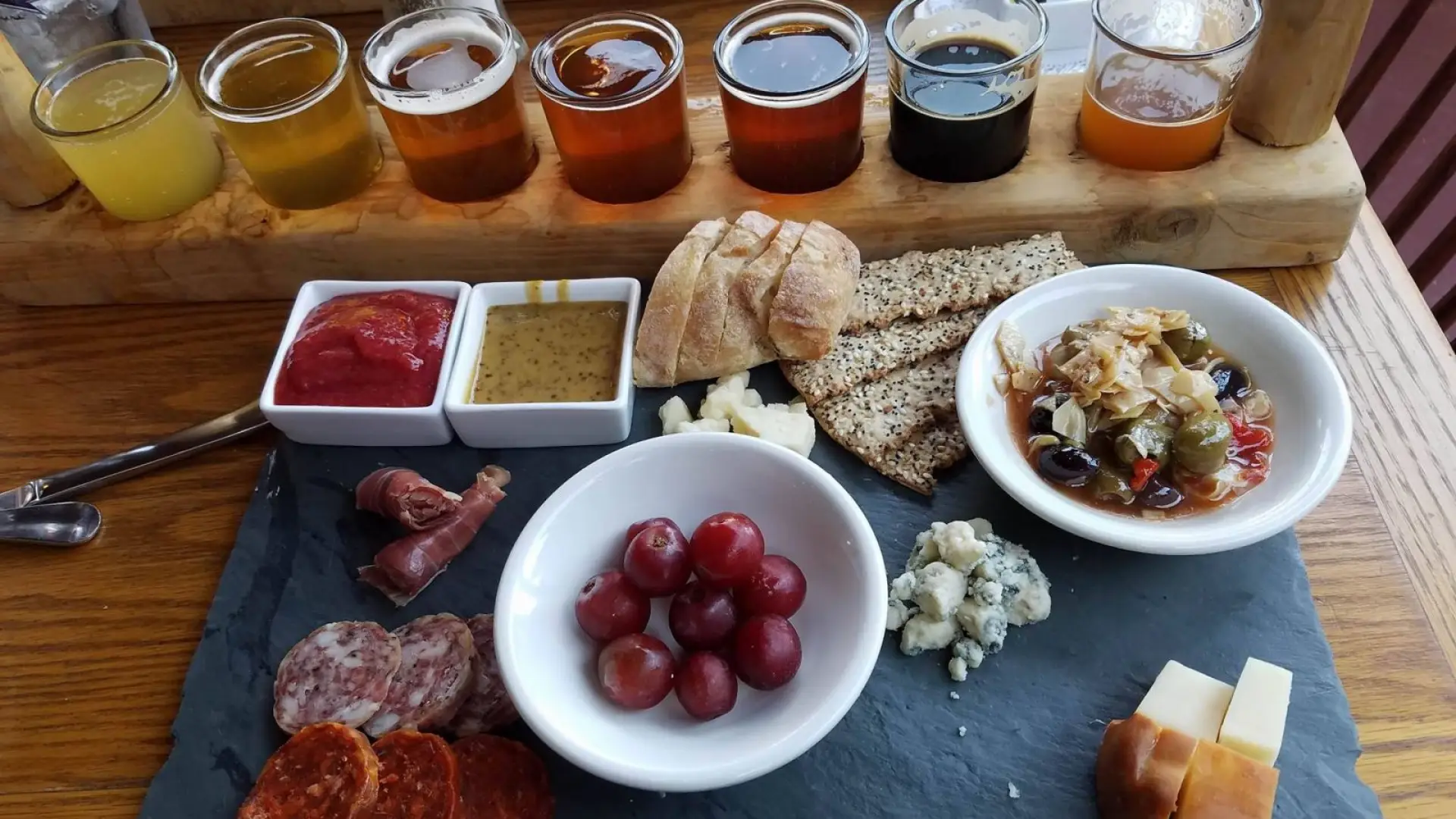 My beer flight accompanied by a delightful cheese and meat platter.