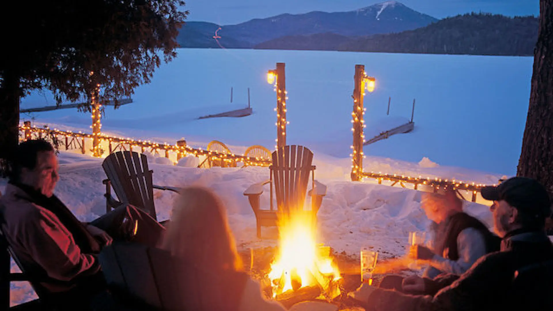 Look over frozen Lake Placid to Whiteface Mountain beyond, while a blazing firepit warms us outside, and eat and drink to warm our inside.