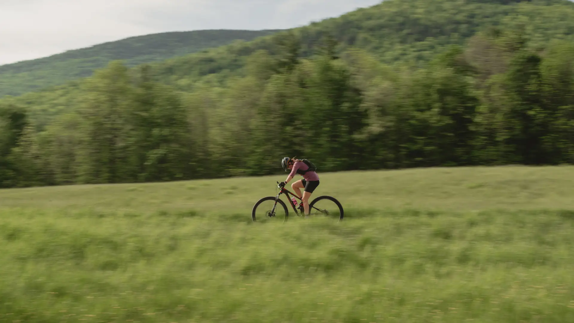 Bike racer crosses field