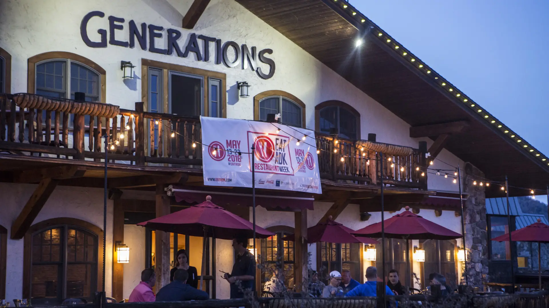 A tuscan-style restaurant patio at night.