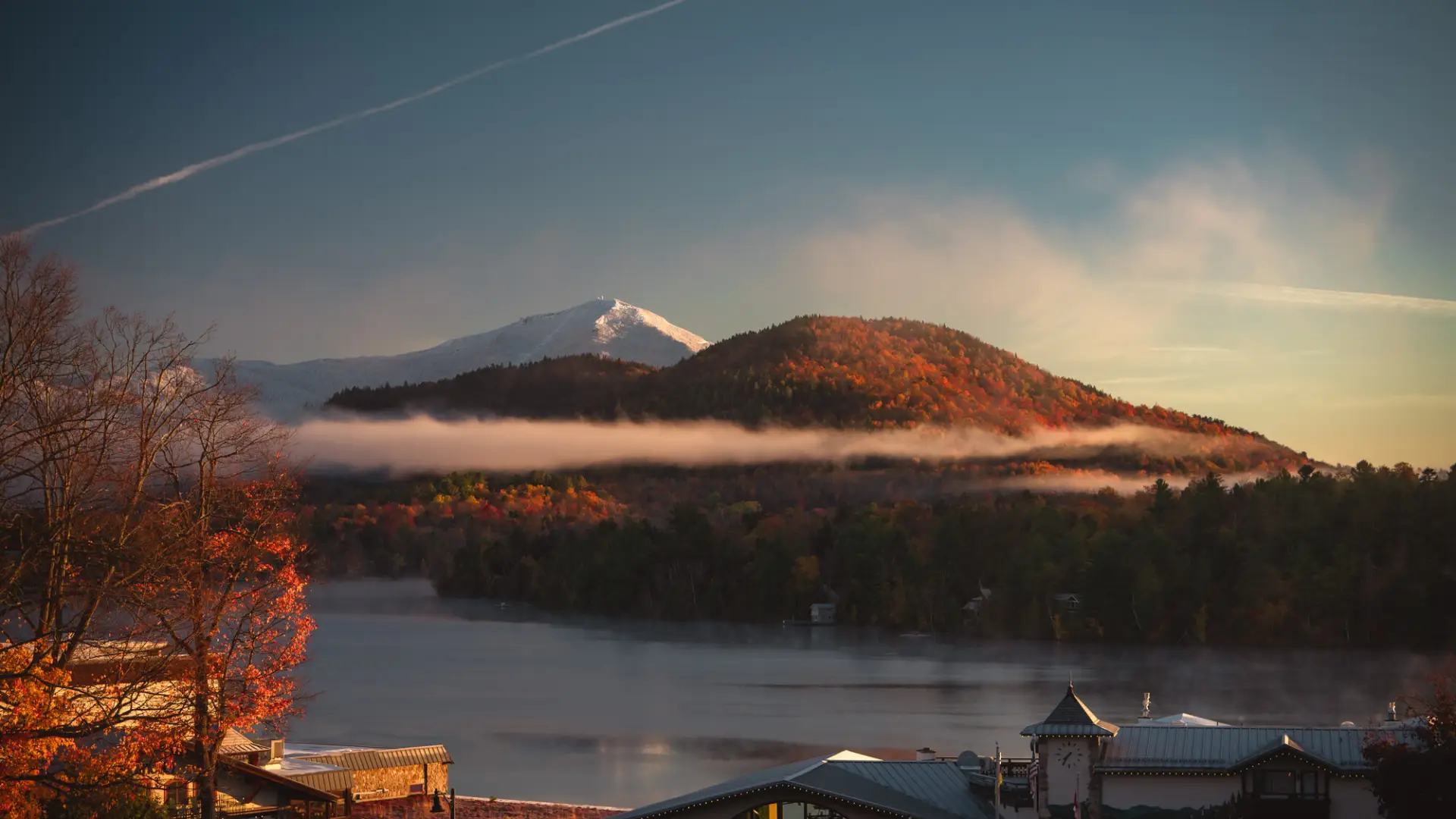A fall mountain top with frosted snow. 