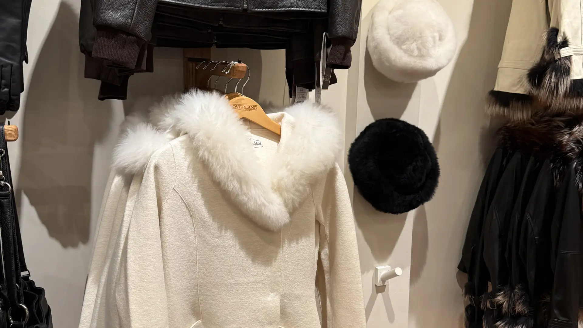 Coats with fur trim hang on the walls at Overland Lake Placid.