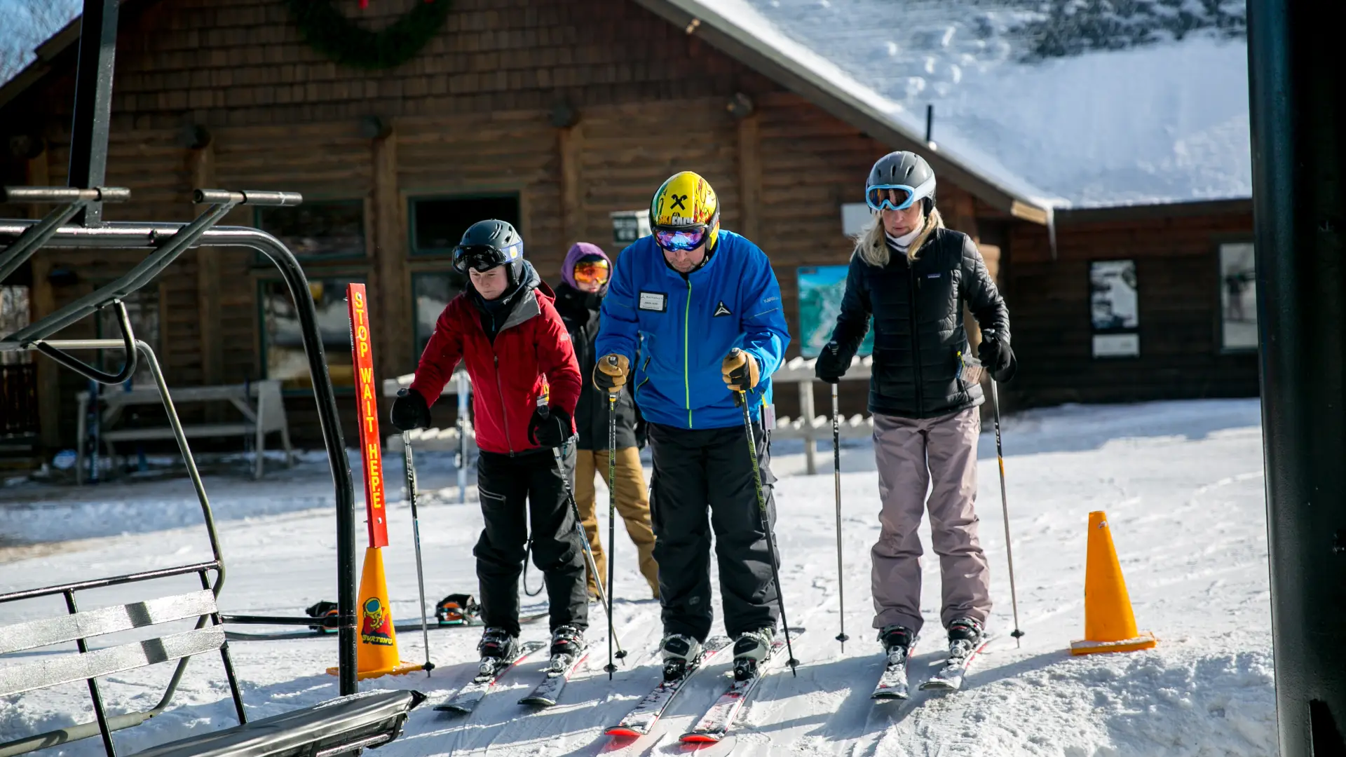 Two skiers start a lesson.