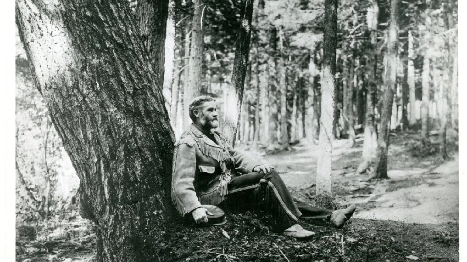 Van Hoevenberg at base of tree c. 1900-1905