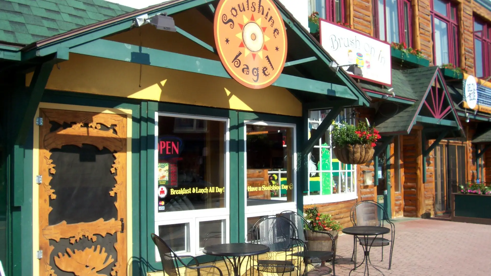 The front of a happy bagel shop named Soulshine Bagel.