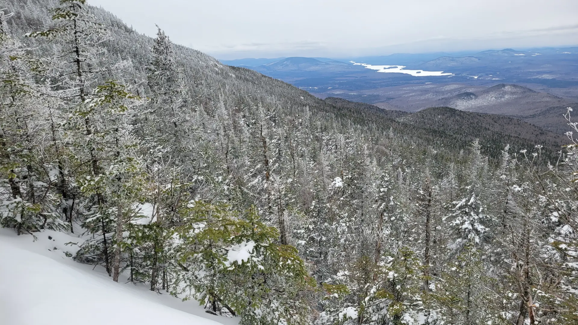 view down towards a long lake in the winter