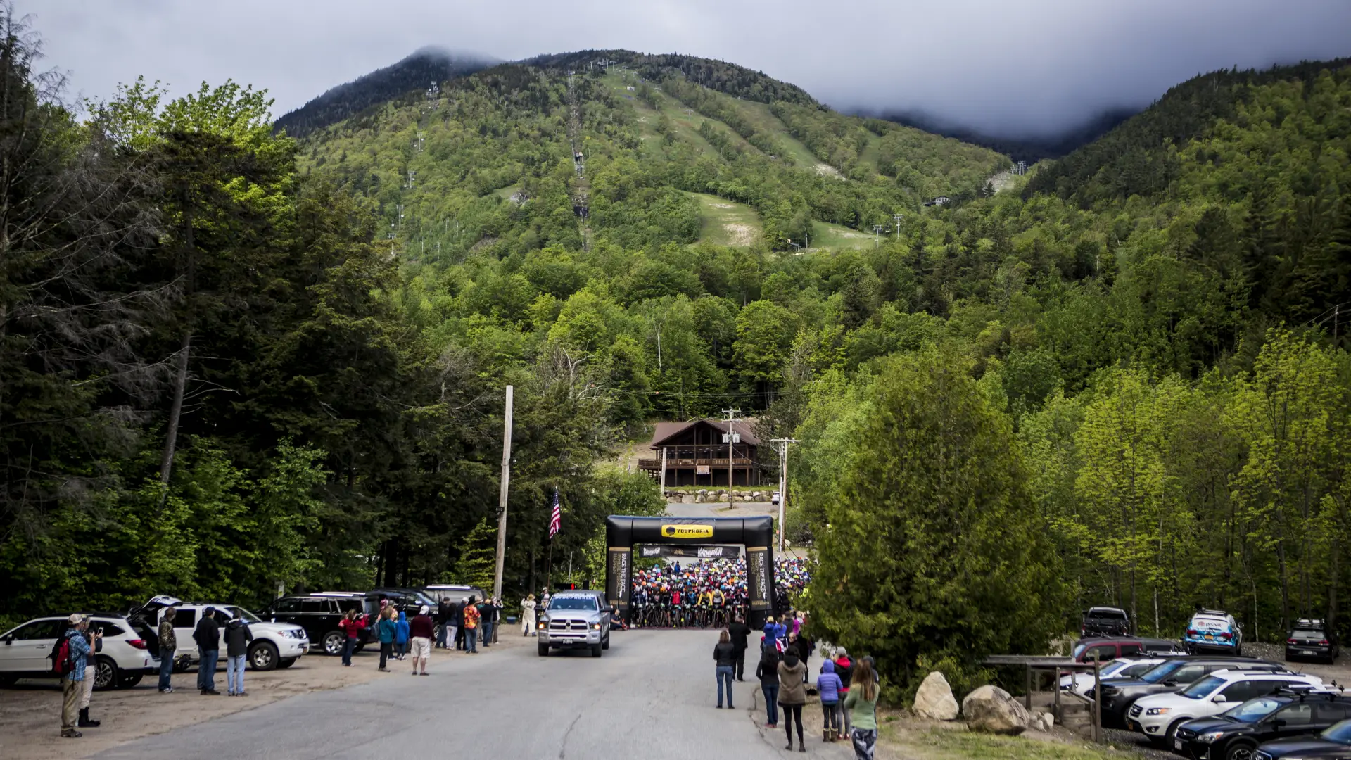 A ski mountain is the backdrop for a mass start for a biking race