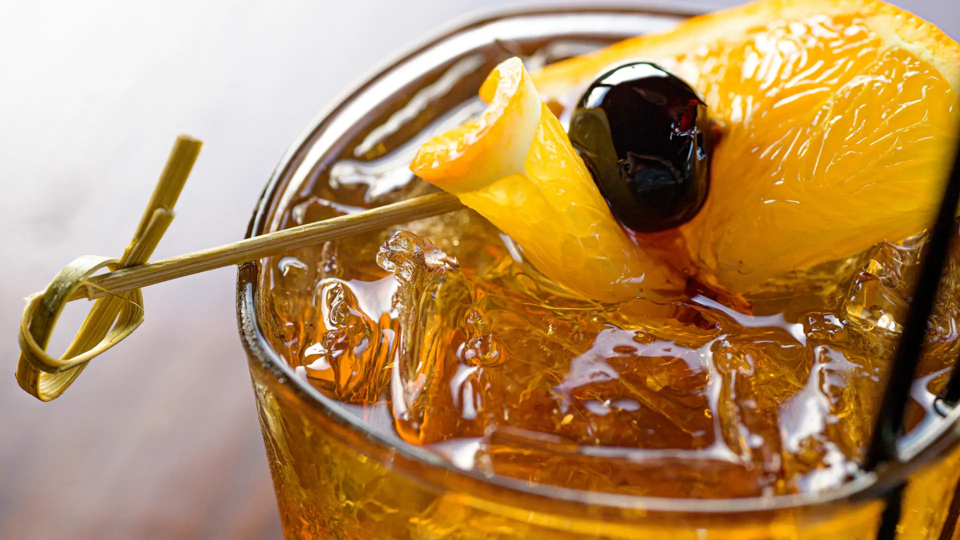 Cocktail with orange and luxardo cherry