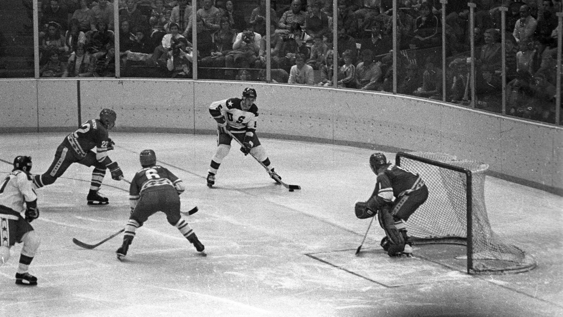 A black and white photo of a hockey game in 1980 at the Olympic Winter Games in Lake Placid.