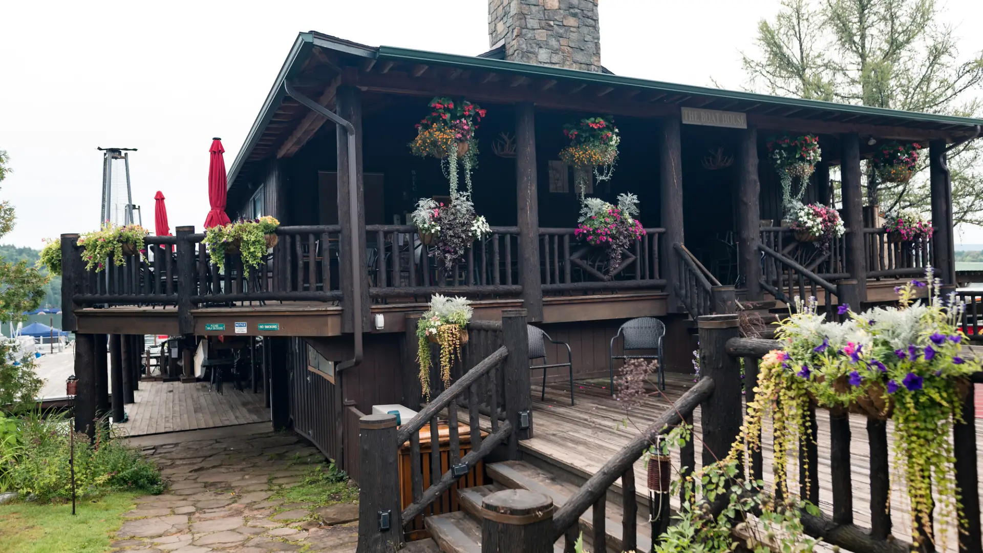Moose Lodge Boathouse in summer with hanging baskets of flowers