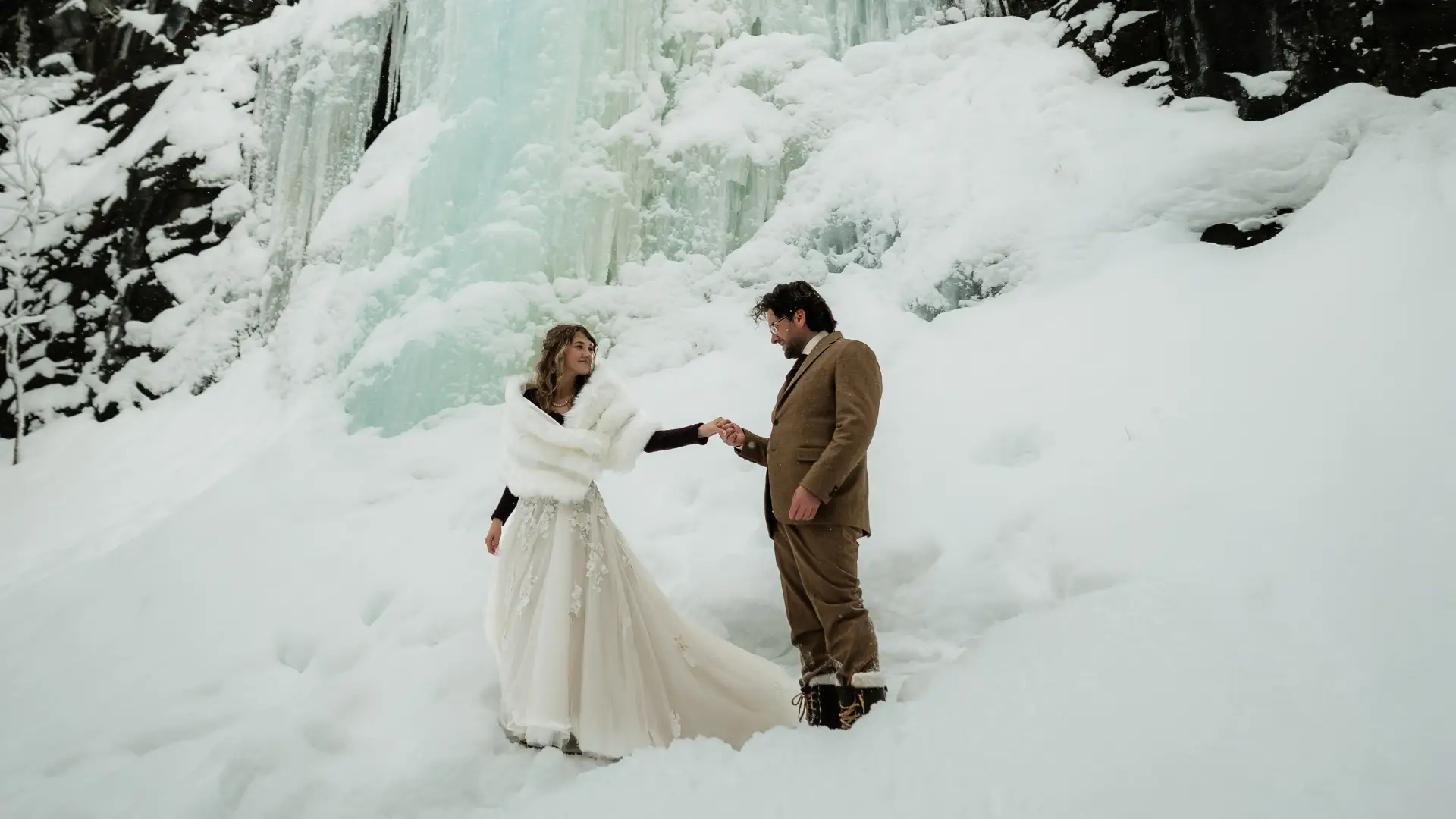 Ice flows behind a bride and groom