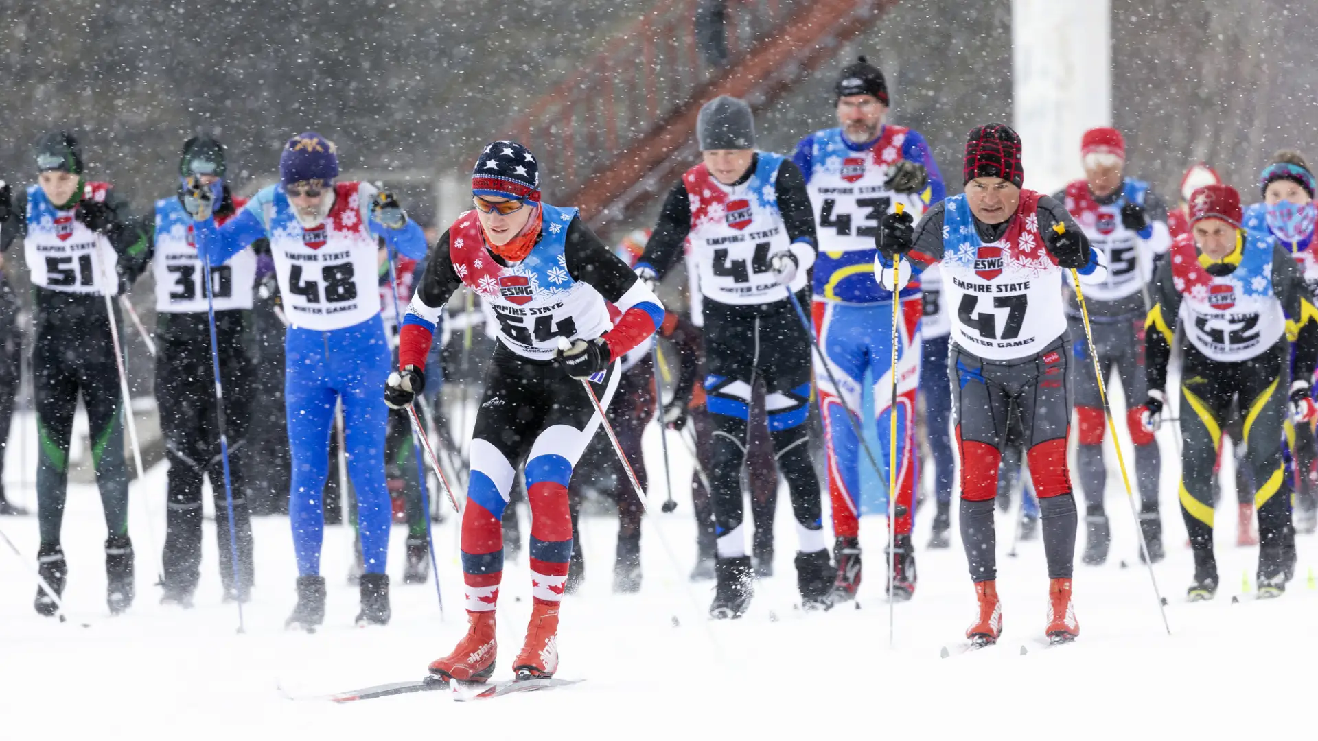 Group of nordic skiers competing in a ski race.