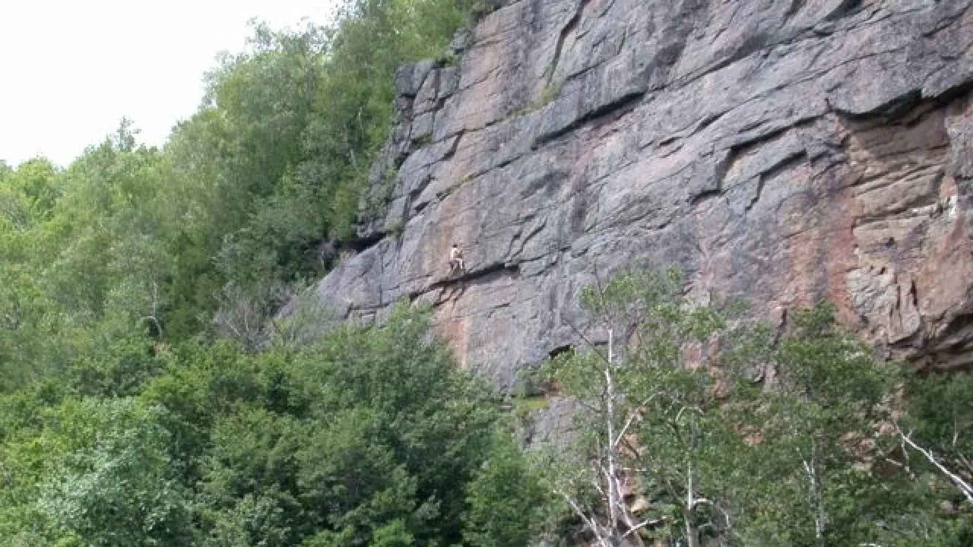 Rock Climber on cliffs of Pitchoff