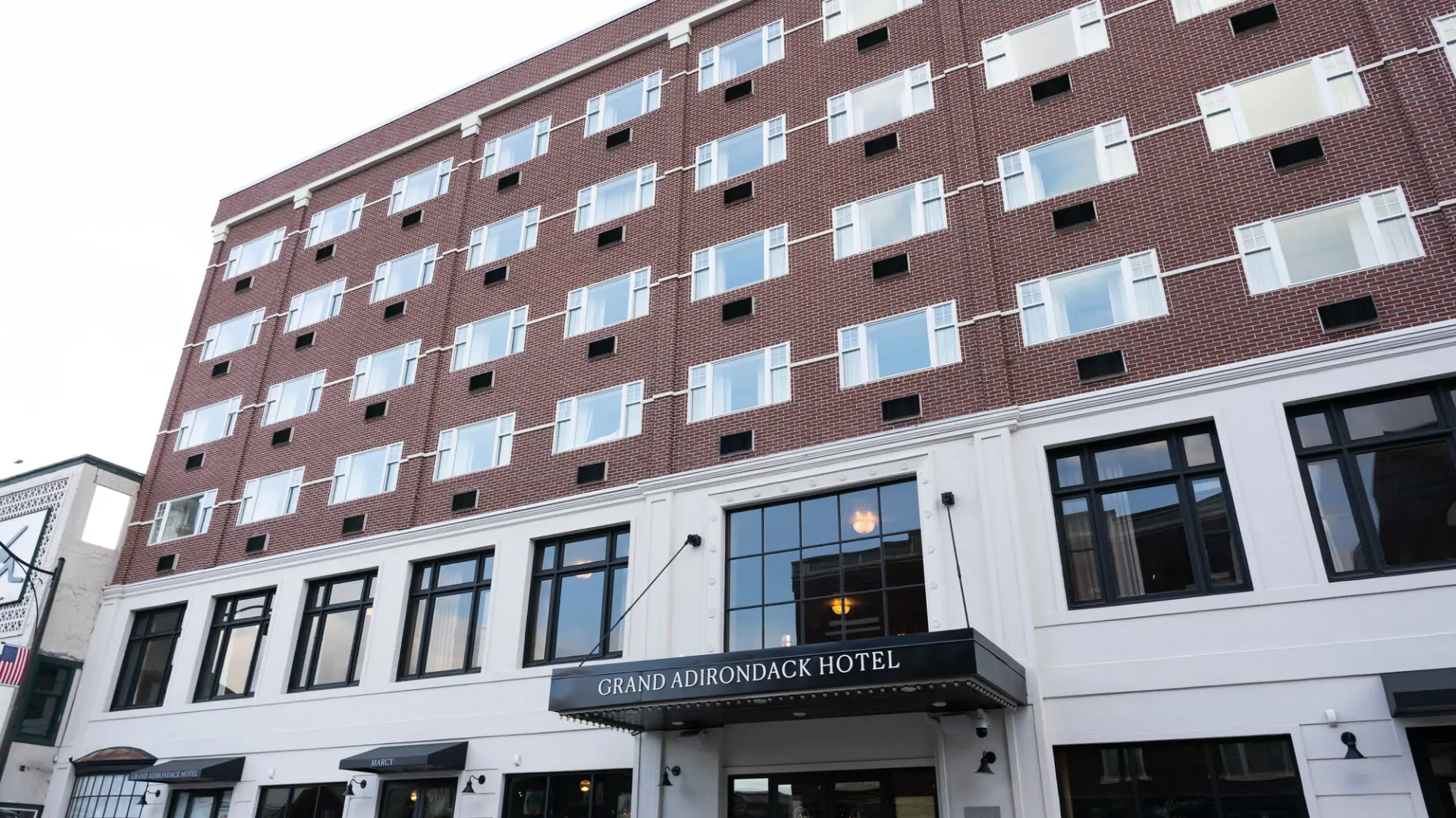 The exterior of a brick-faced hotel