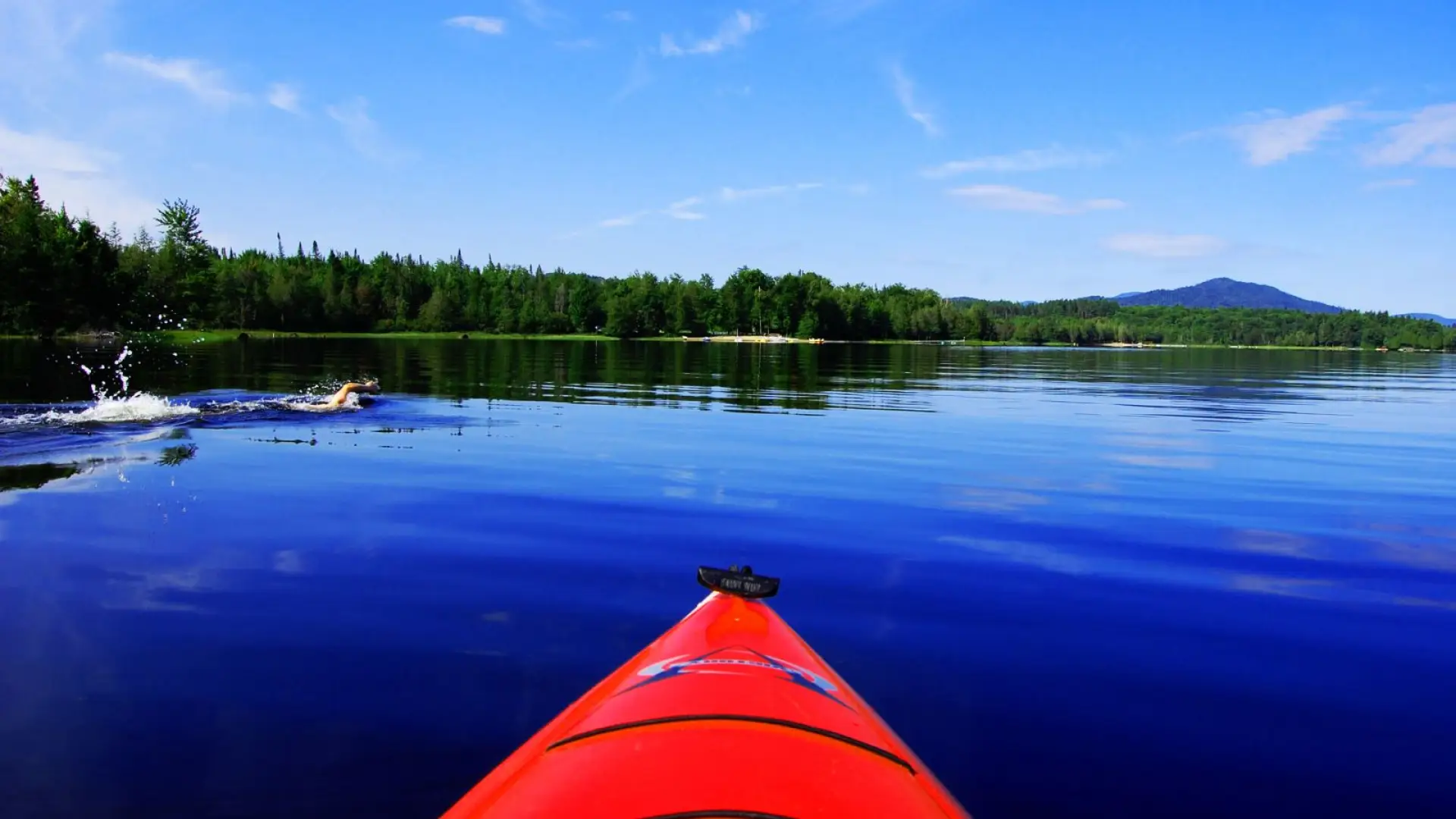 Kayaking and swimming on Lake Harris.