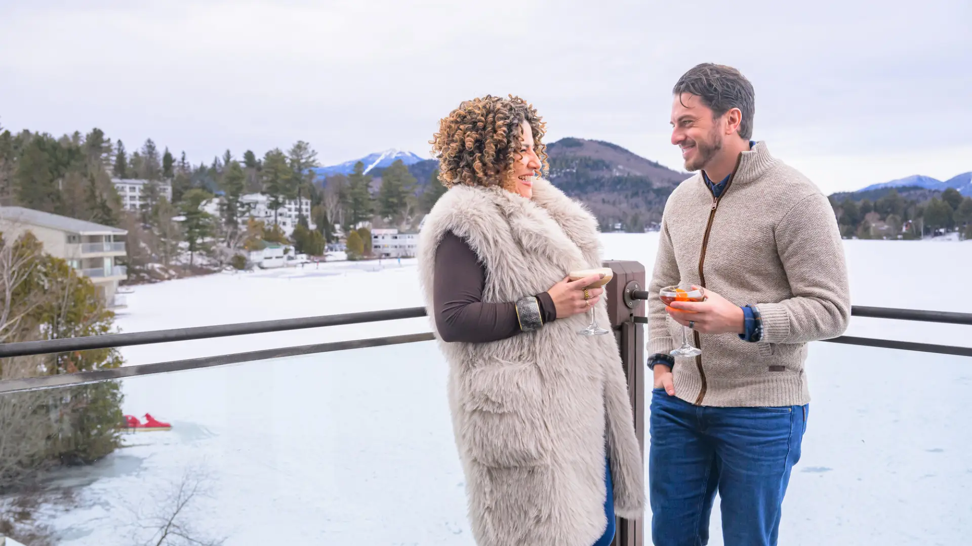 A couple drinking on patio in the winter