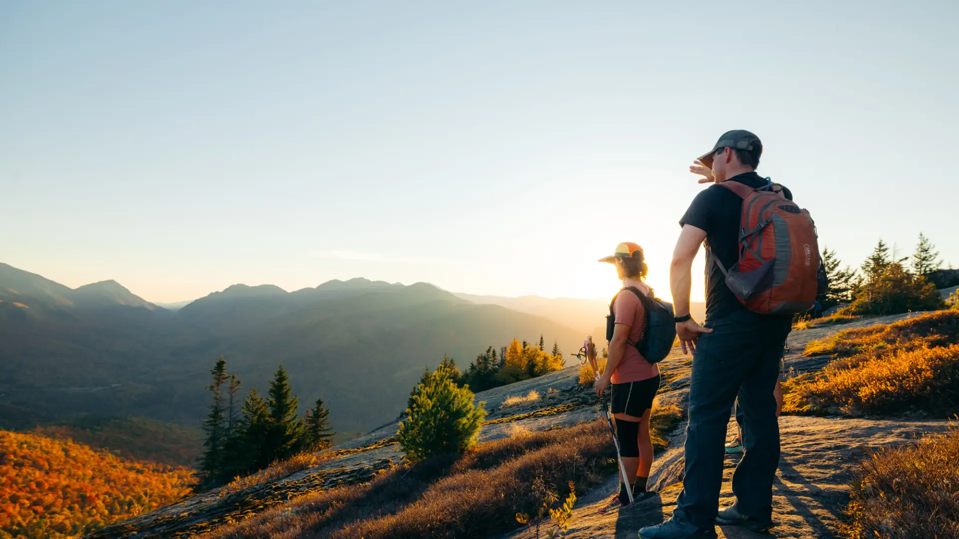 Two hikers on a fall summit