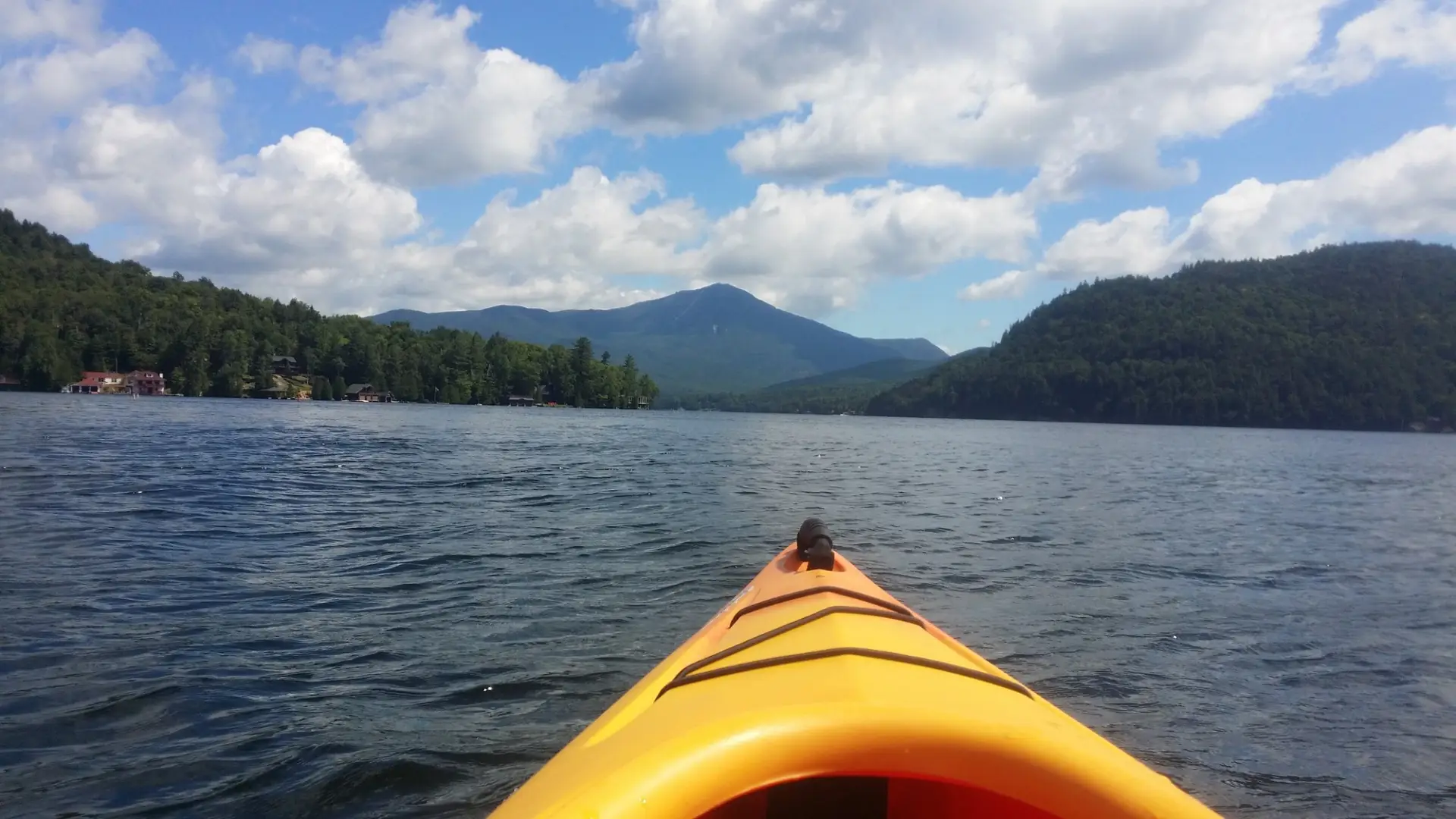 A kayak on Lake Placid lake. Whiteface Mountain is in the background.