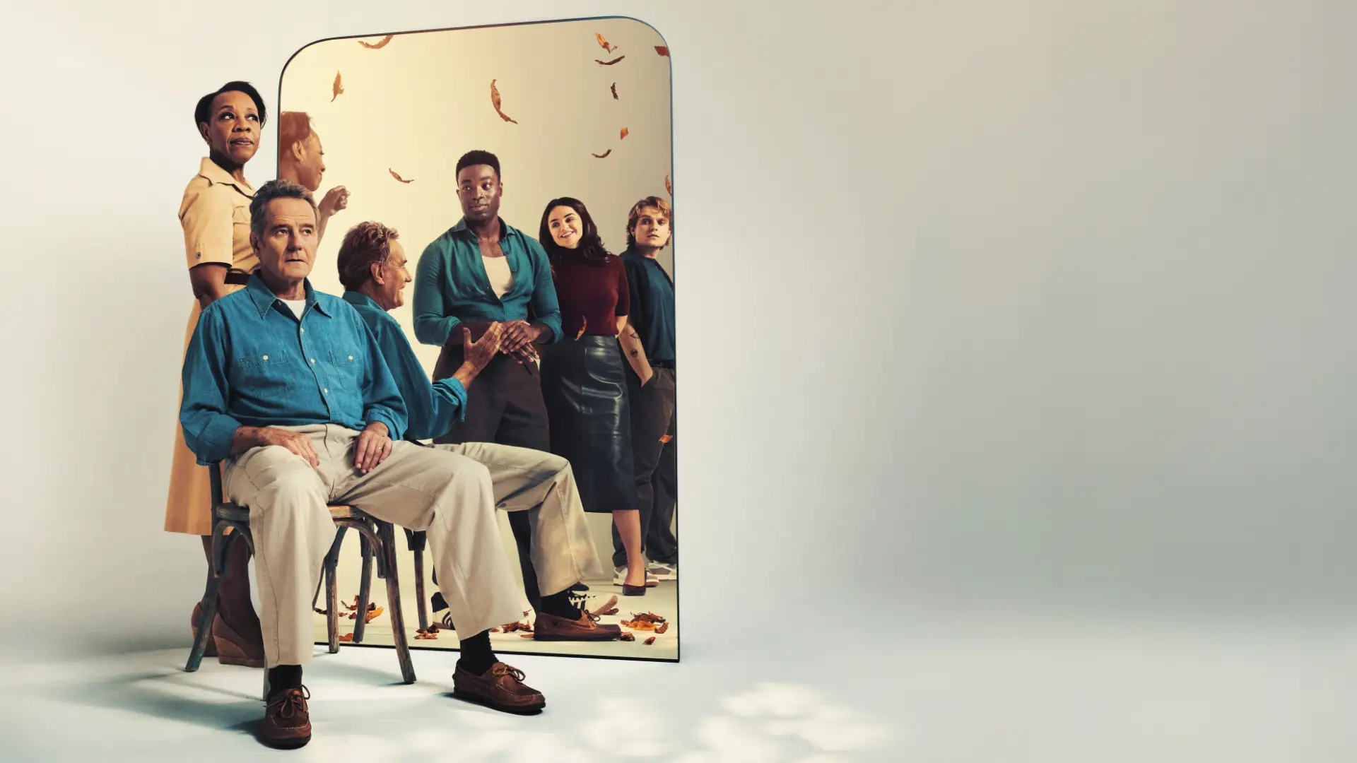 All My Sons promo shot of Bryan Cranston sitting in front of mirror with woman behind him and more people reflected in mirror