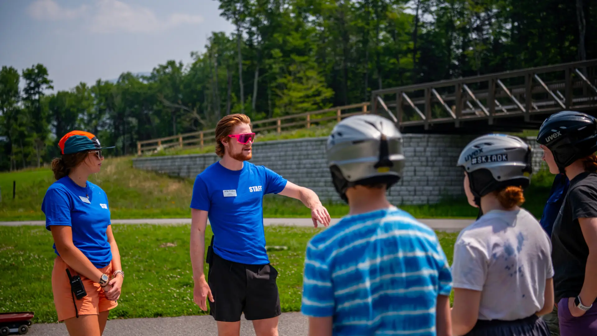 Instructors teaching safety of an activity at Mt Van Hoevenberg