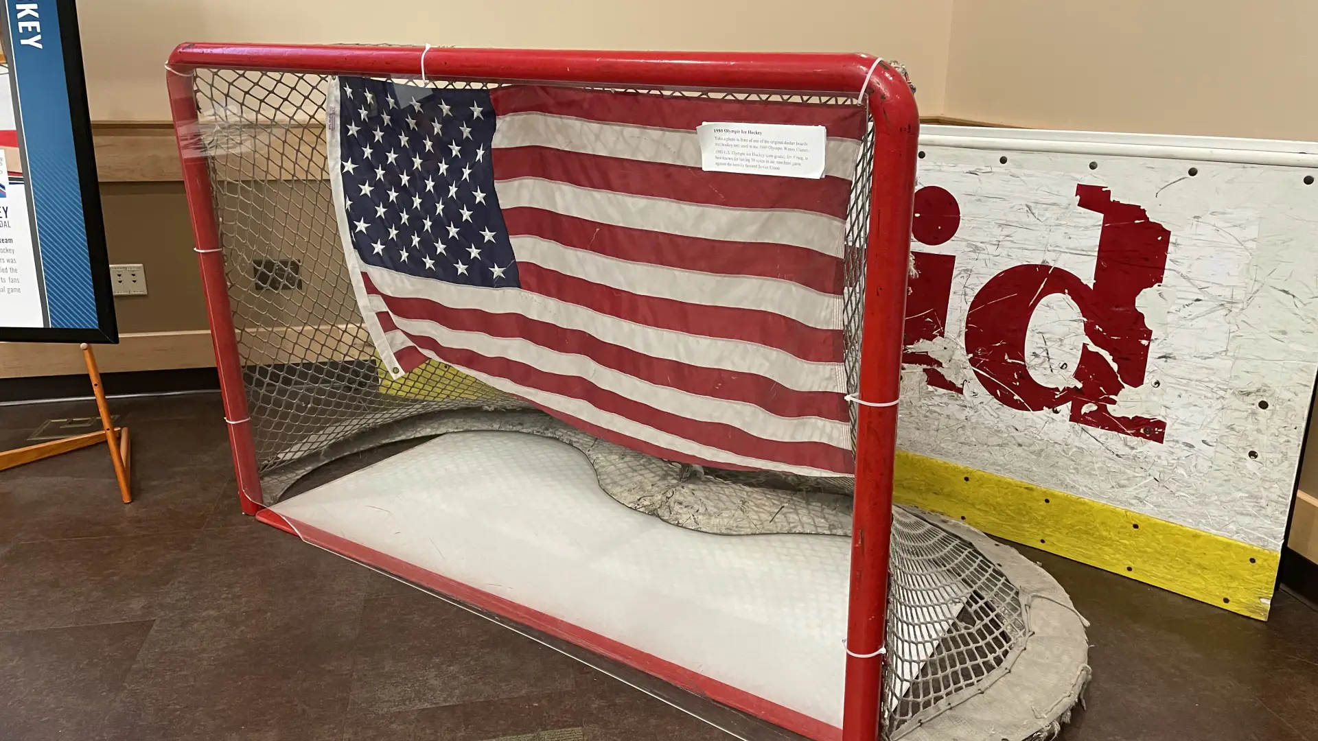 A hockey goal net and rink boards on display. They were used in the 1980 Olympic Winter Games.