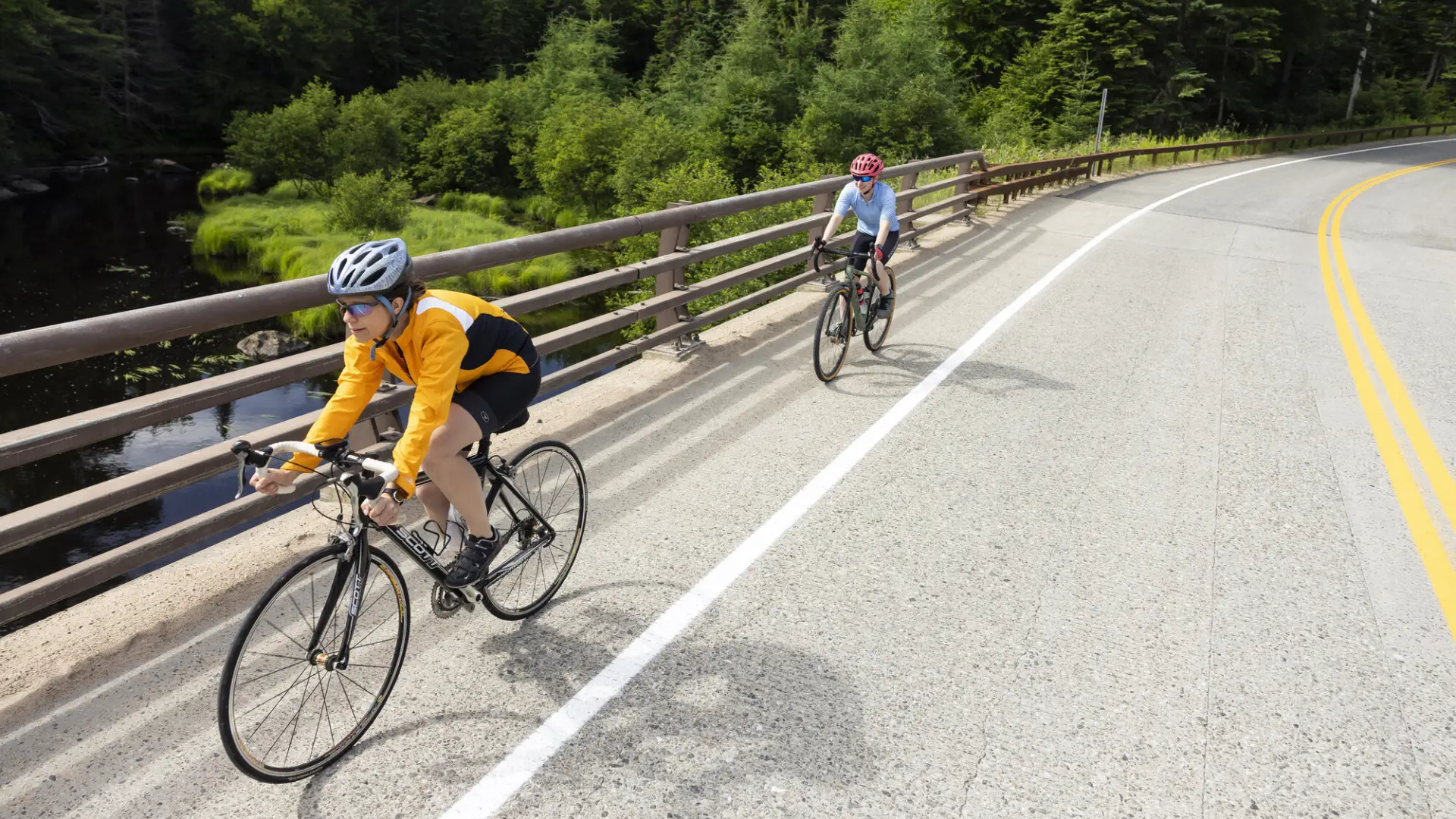 Two cyclists on the road in Lake Placid, NY