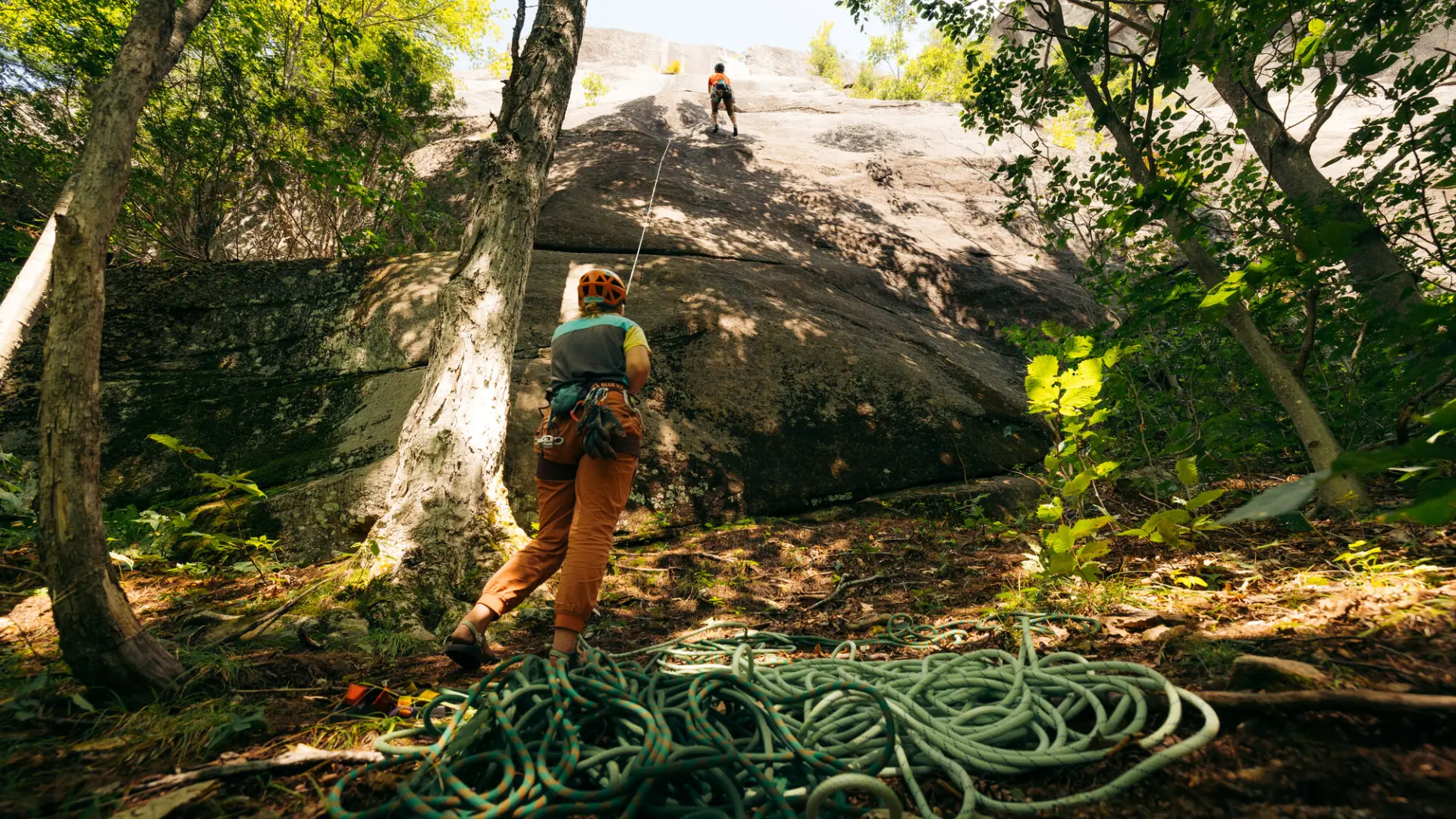 A belayer and a climber at a crag