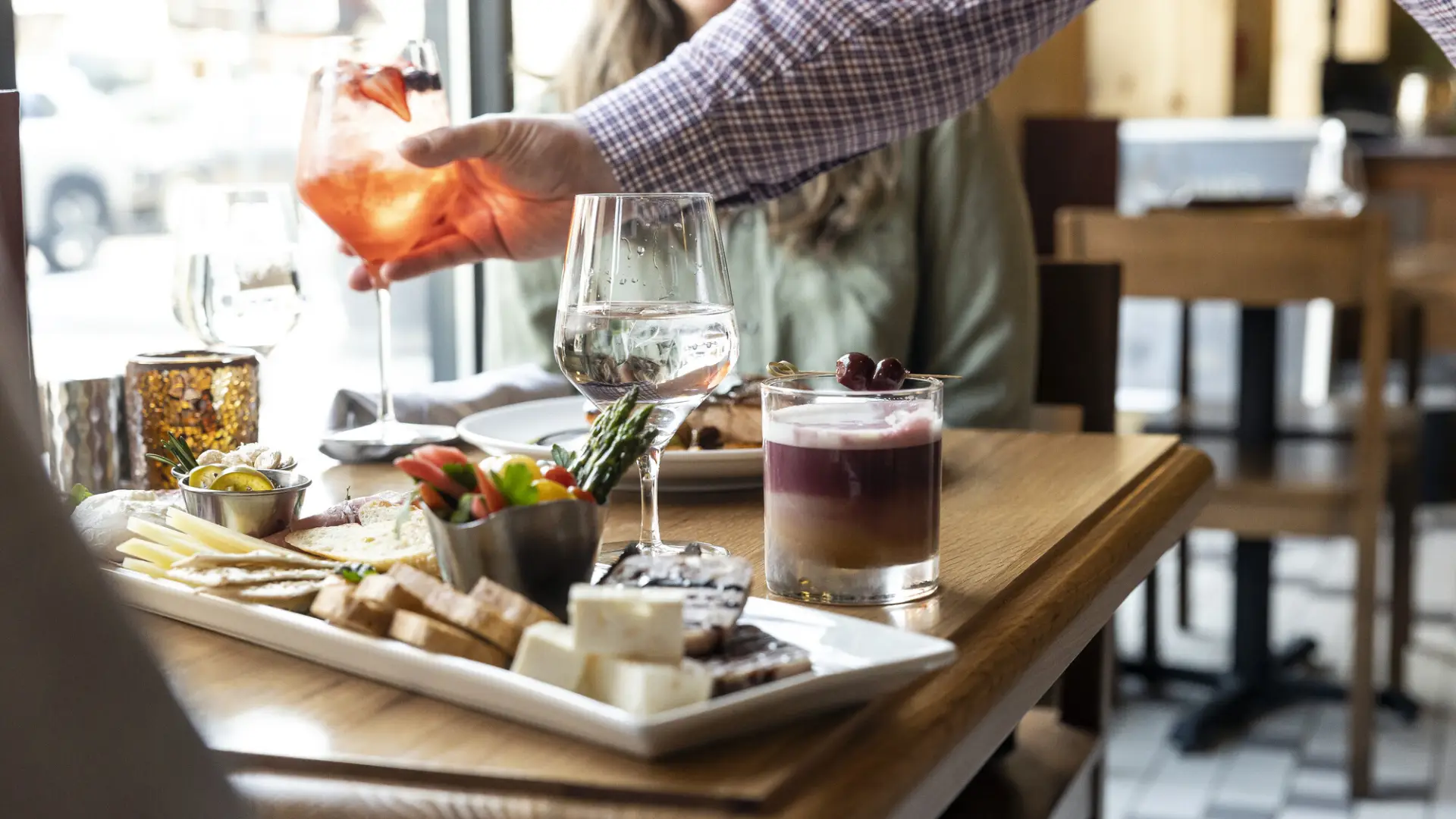 A charcuterie board paired with craft cocktails.