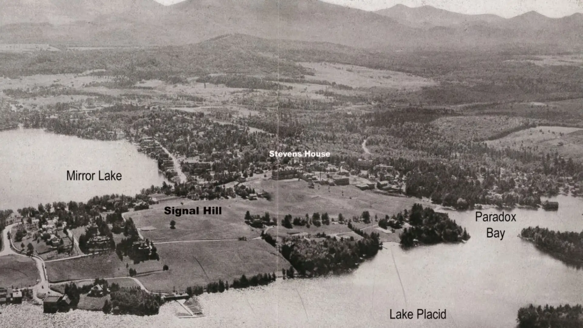 An aerial view of Lake Placid Village from the early 1900's