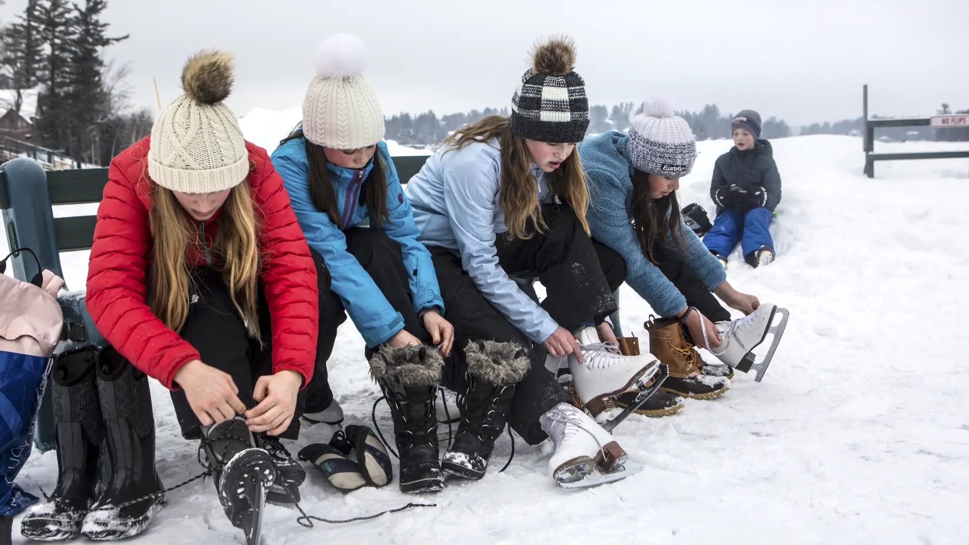 Putting skates on by Mirror Lake