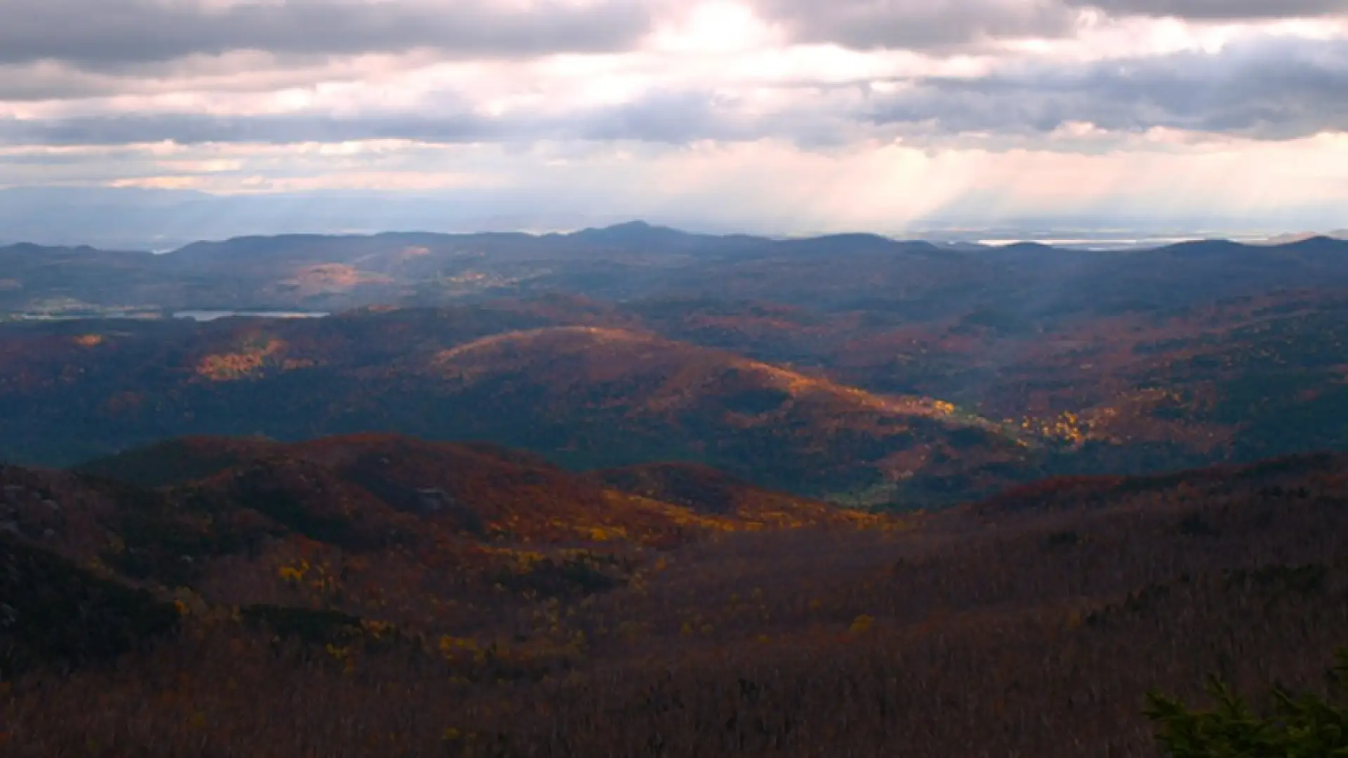 The sunshine through the clouds intensifies the colors.